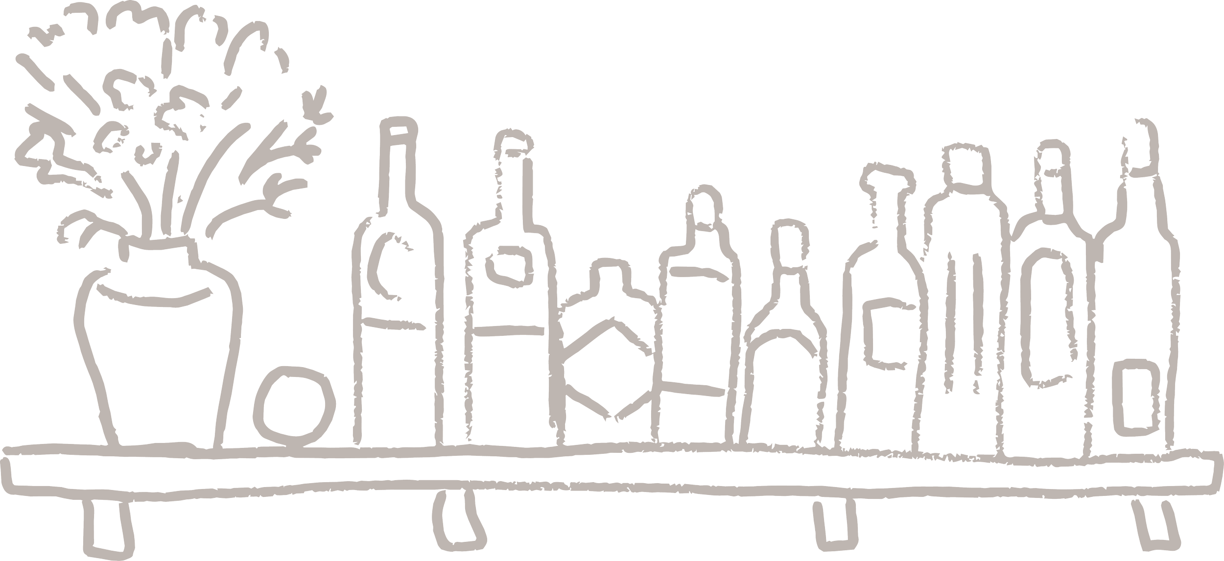 A row of bottles used for cocktails, aperitivo, and evening bar ingredients