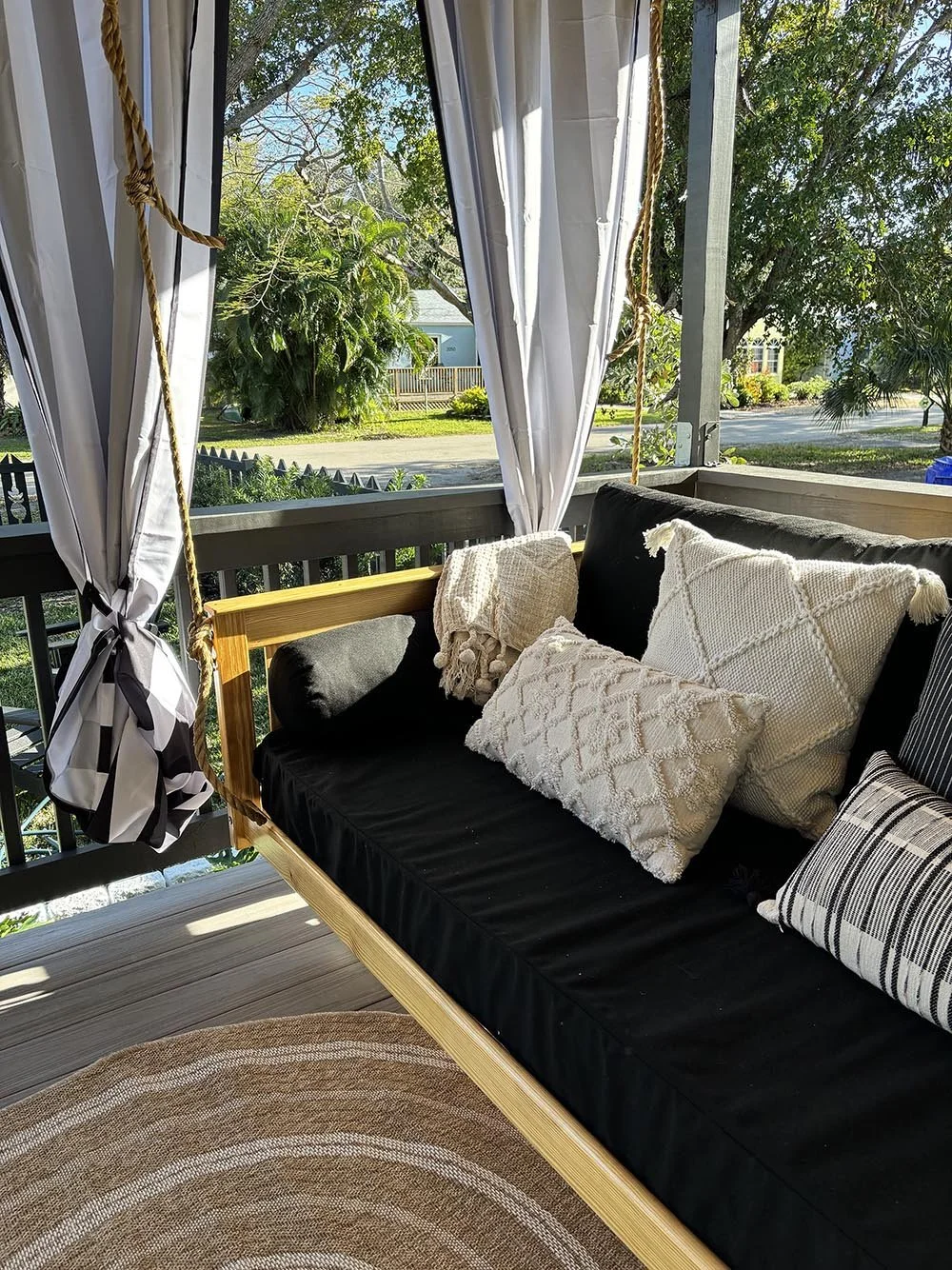 Bed porch swing with pillows at Dun Dapple Cottage