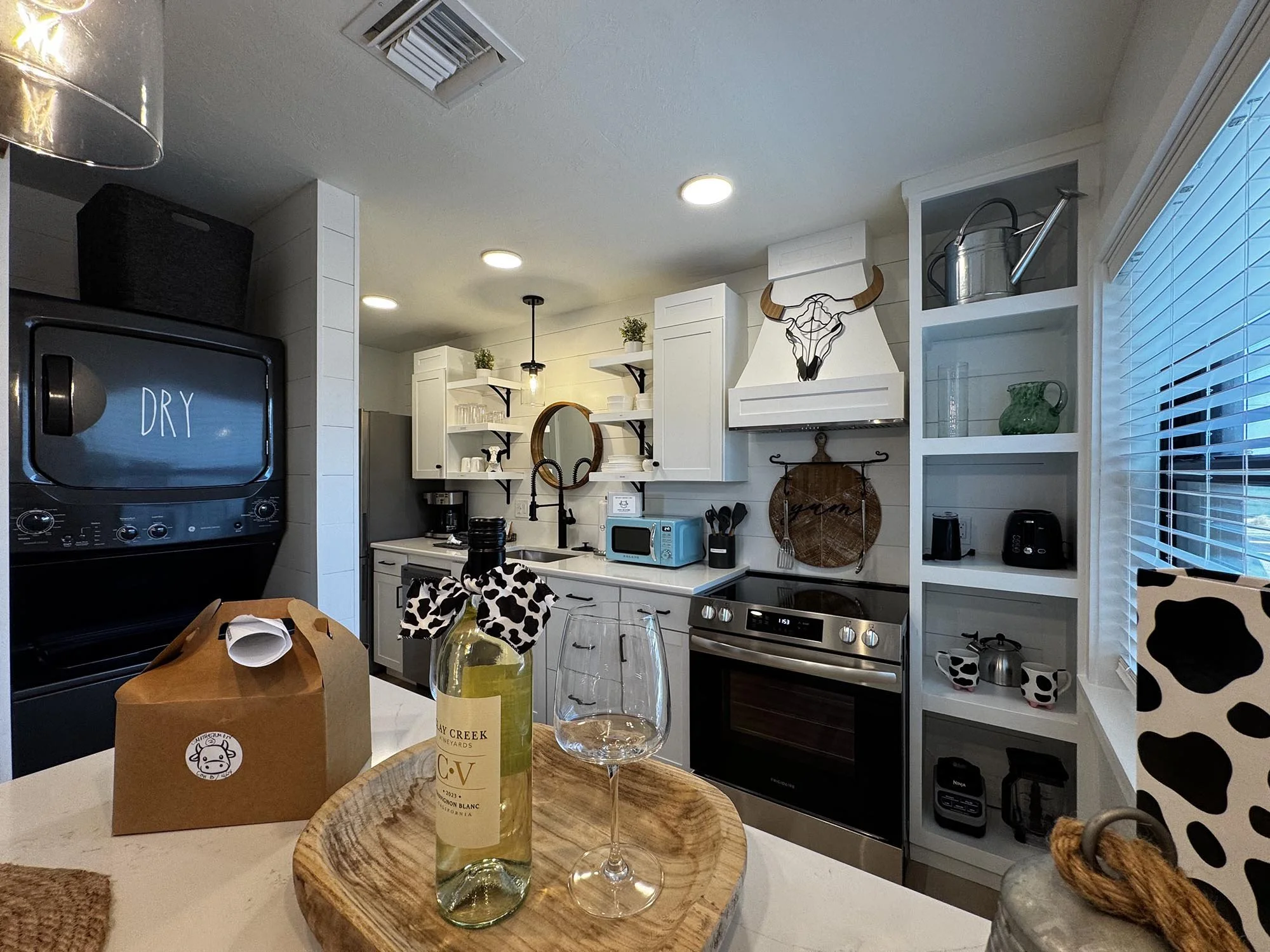 Cute kitchen with welcome kit for guests at Cracker Cow Cottages