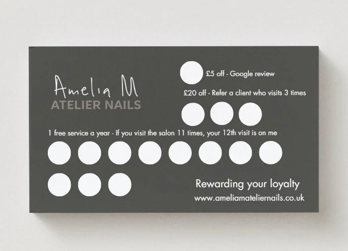 Loyalty card for Amelia M Atelier Nails with stamps and discounts for services, featuring contact details and rewards info.