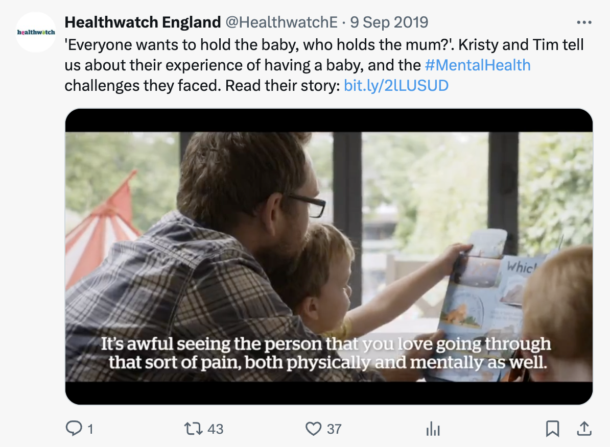A screenshot of a social media post shared by Healthwatch England about maternal mental health. The image features a dad with his child reading a book indoors by a window with trees outside.
