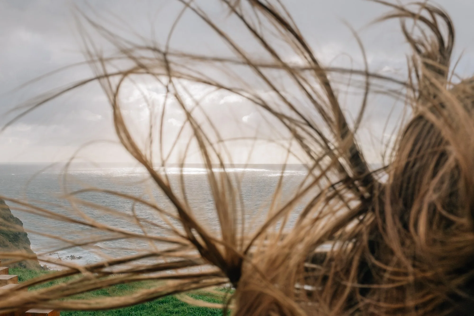 Kendal catching wind at Miradouro da Ilha Sabrina