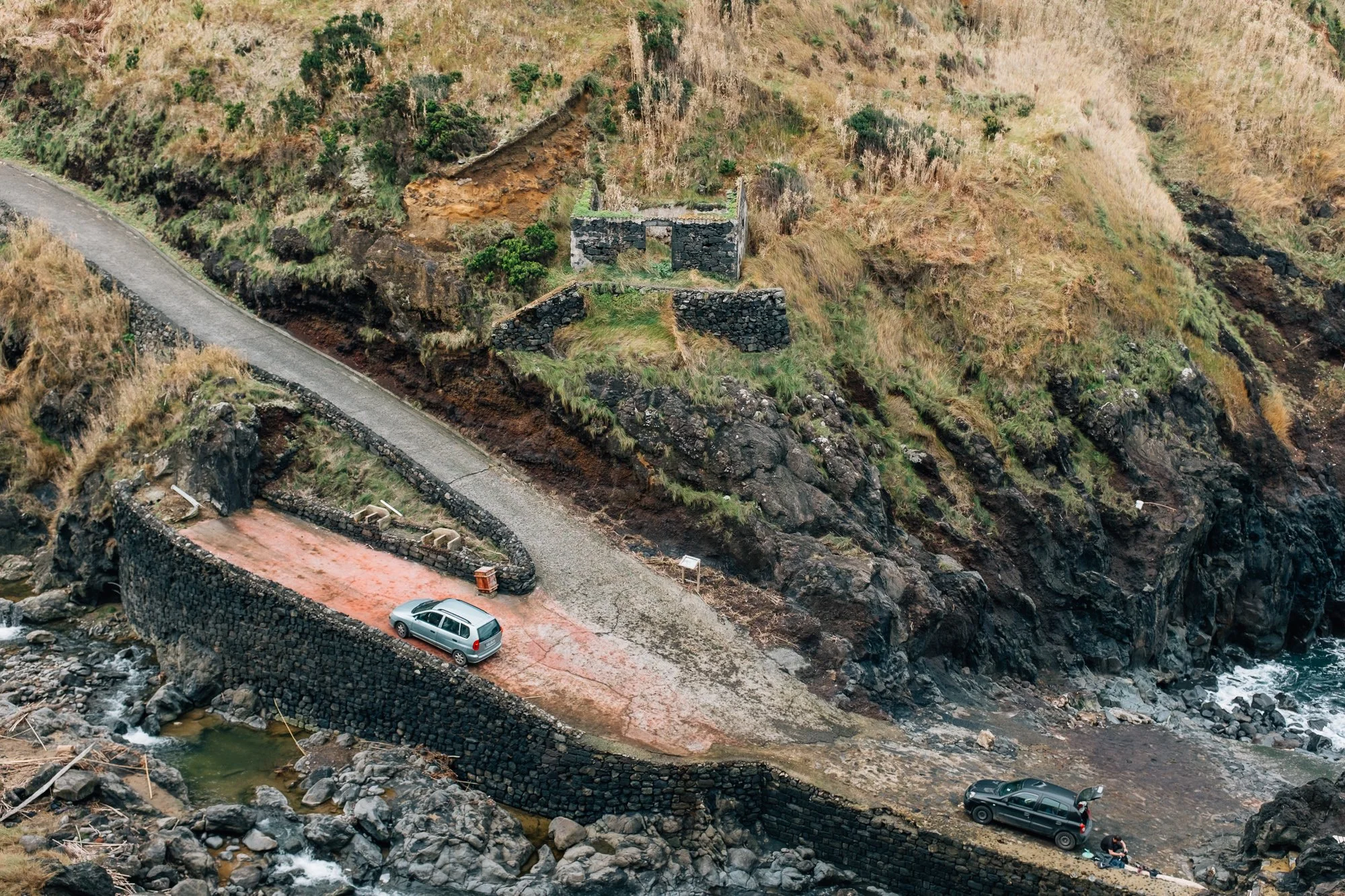 Packing up limpets (lapas) after a dive at Porto Pesca. Traditional seafood, typically grilled with butter, garlic, and pepper, eaten straight from the shell, similar to clams or oysters.
