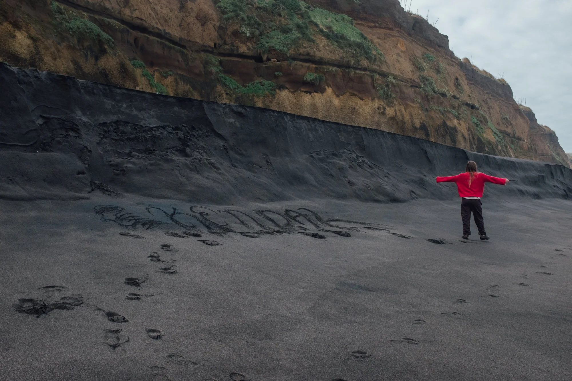 Praia do Areal de Santa Bárbara. Black-sand with rolling Atlantic waves, popular with surfers.