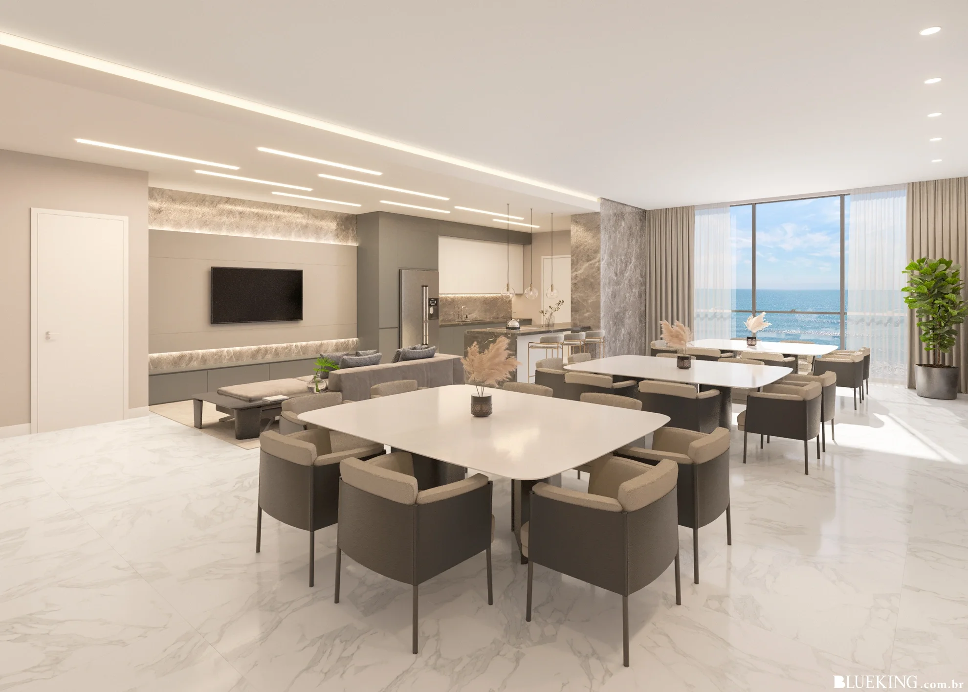 Sala de estar e jantar de um apartamento com vista para o mar, decorada em tons neutros, com mesas de jantar, cadeiras, sofá e televisão, iluminada por luz natural e luminárias modernas.