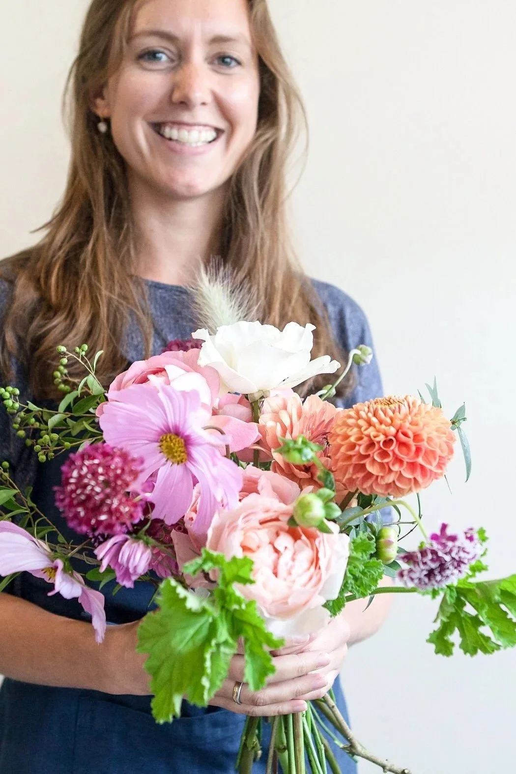 Becky Lacey reconnecting with herself through a floristry course and showing one of the bouquets she designed.