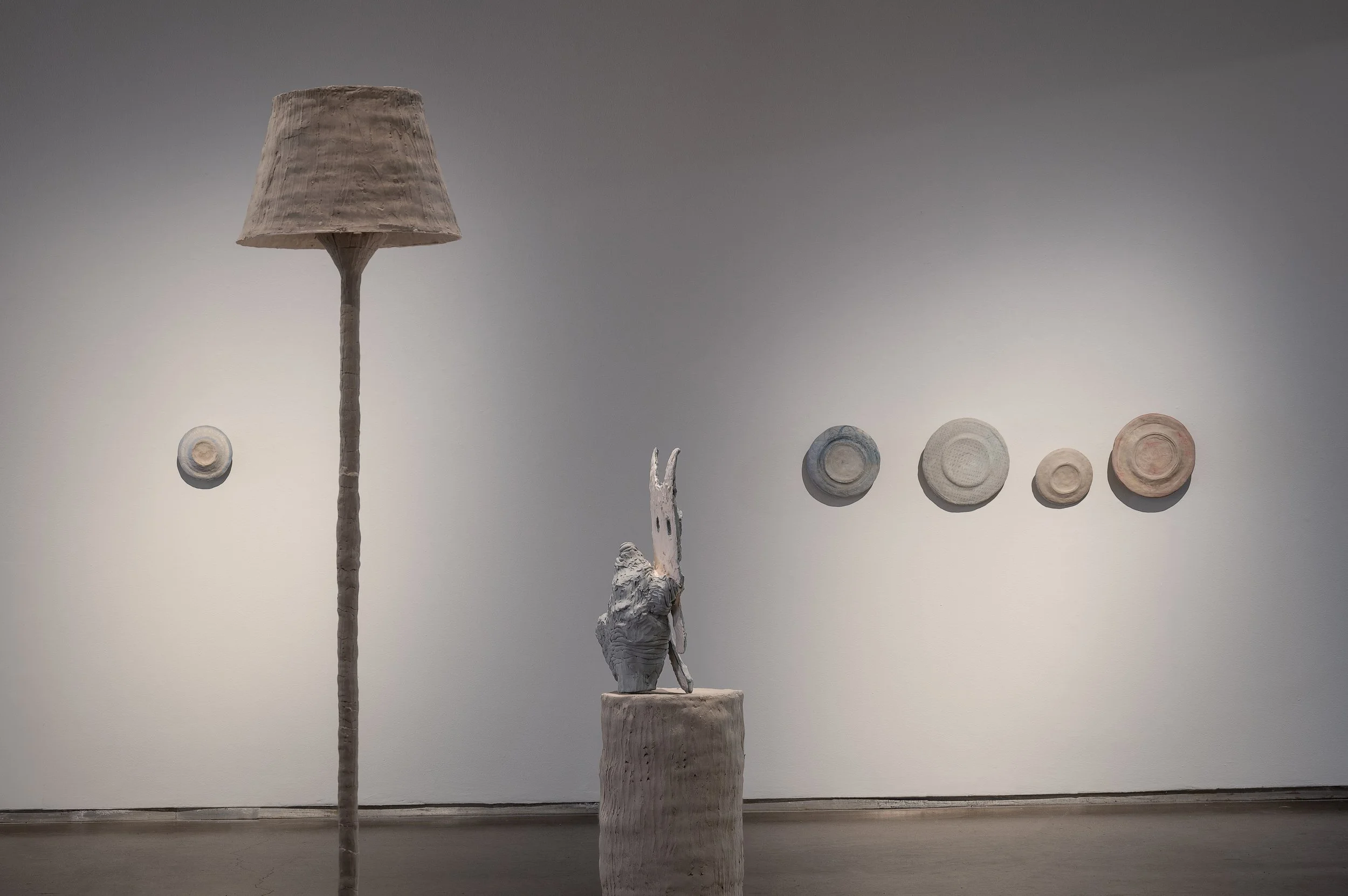  
DAPHNE WRIGHT 
 Lost Cat, 2019  
 Standard Lamp, 2019; 
 Plates, 2019   
 Unfired clay & mixed media  
