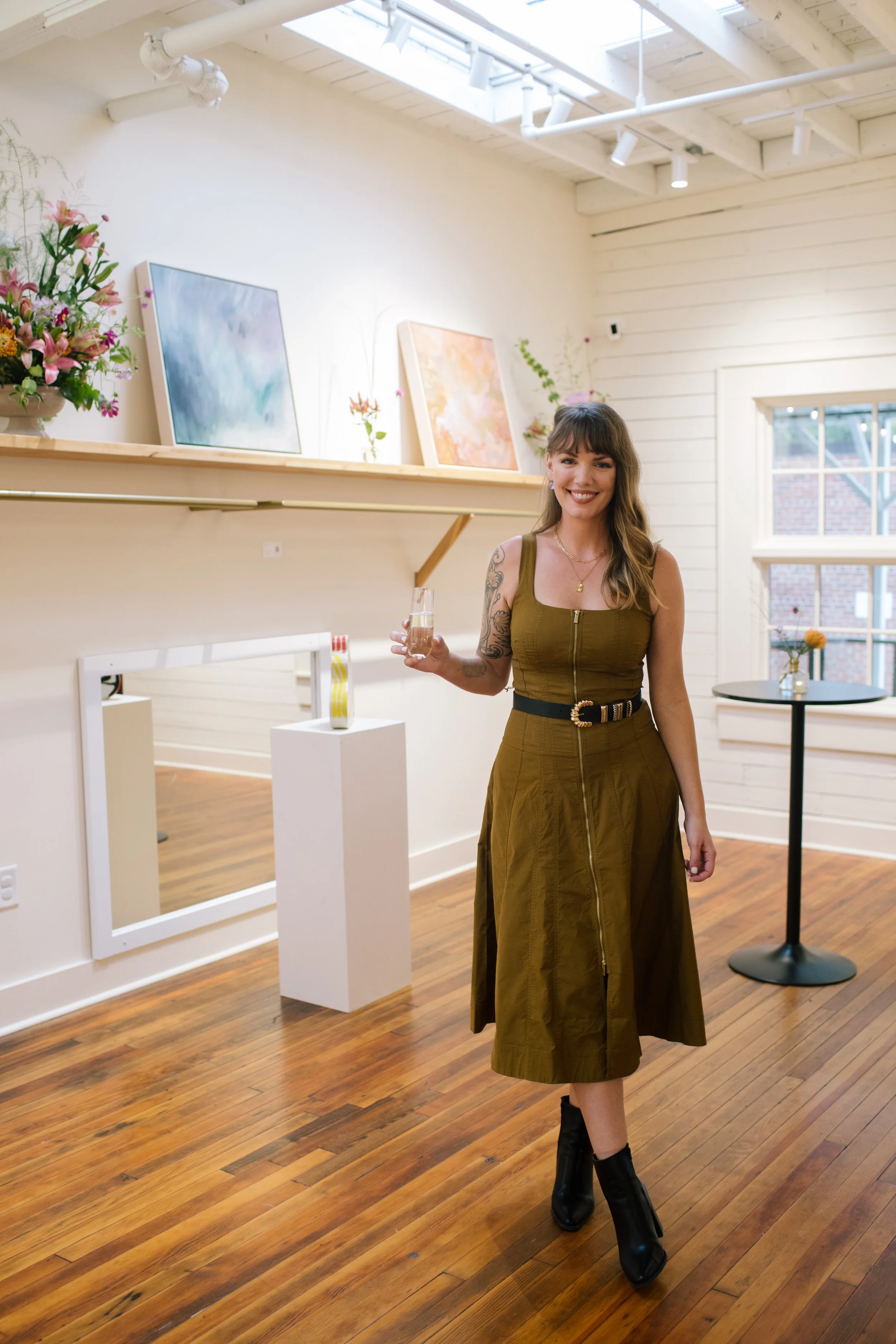 Mom attending a community event at The Reverie in Winston-Salem, a gathering space for Mom League programs and celebrations.