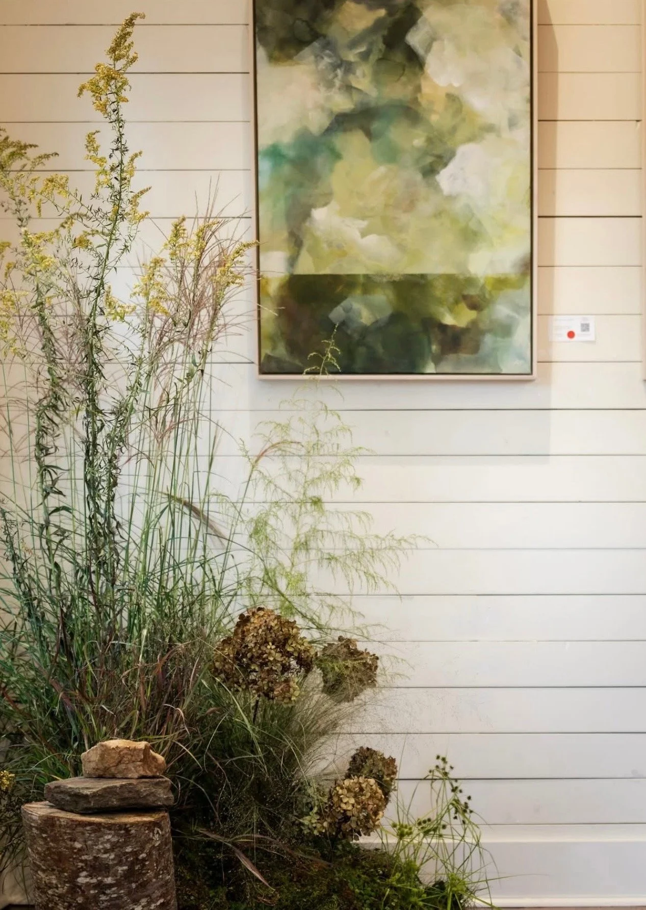 Interior detail of The Reverie, Mom League’s bright event space in Winston-Salem with white shiplap walls and curated decor.