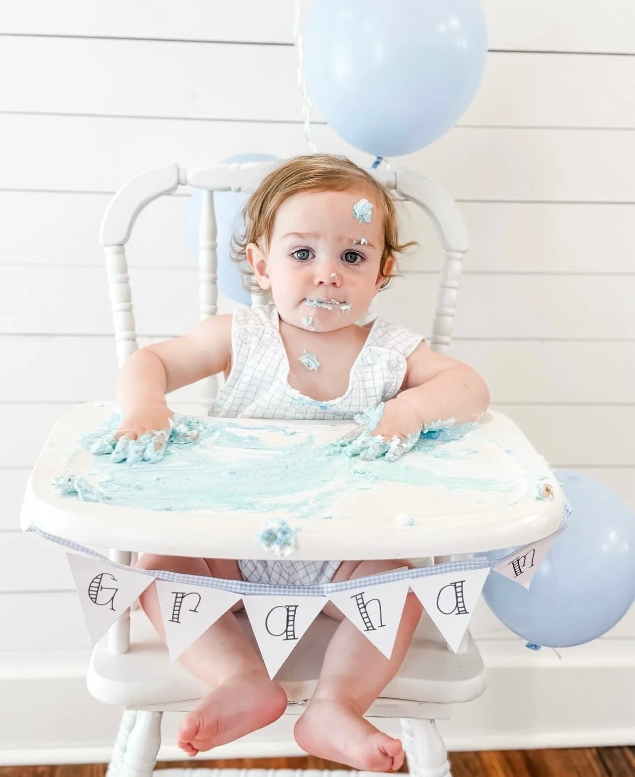 Baby enjoying a cake smash celebration at The Reverie, a Winston-Salem event venue for families and moms.