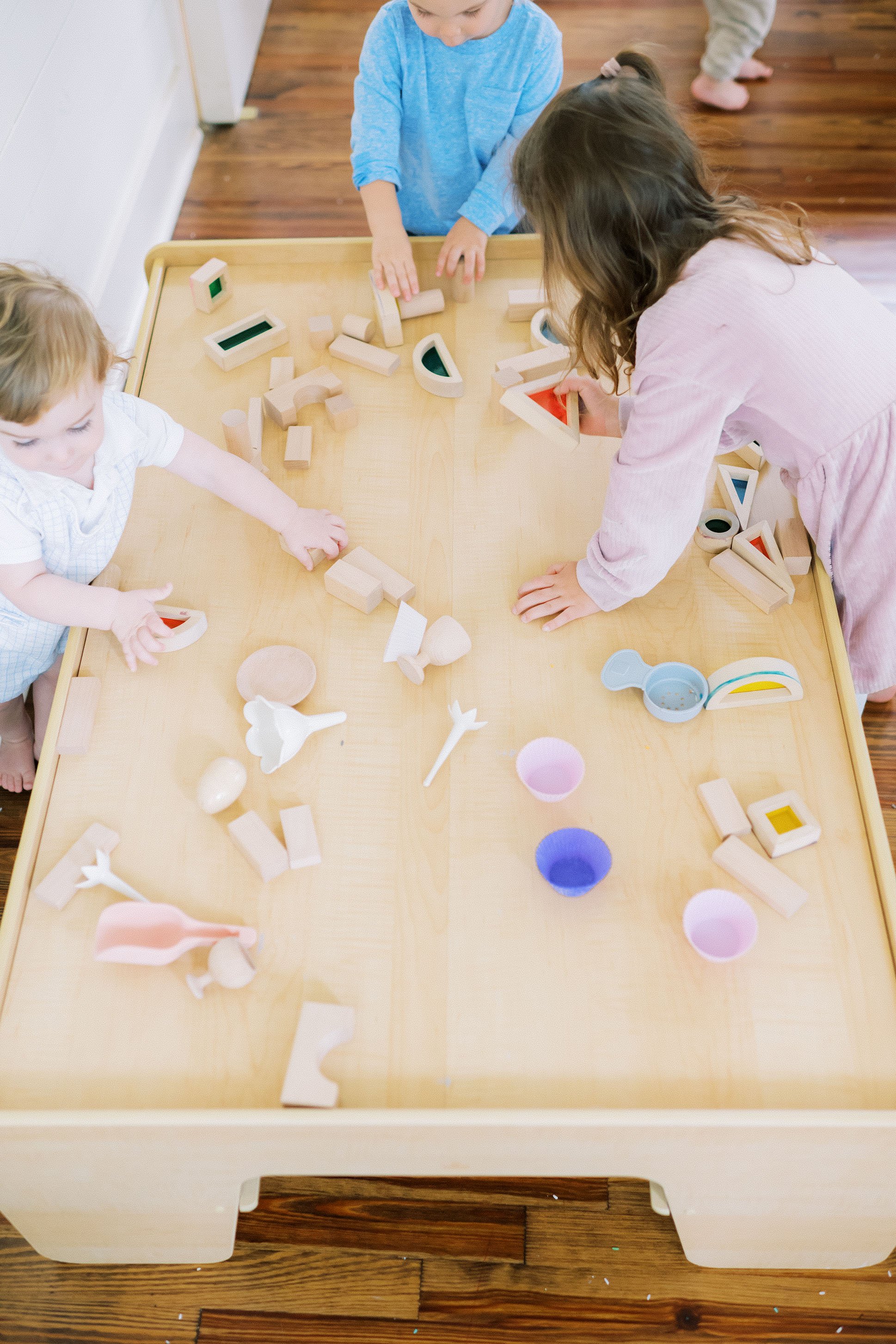 Toddlers exploring sensory toys at a Mom League playgroup in Winston-Salem, NC.