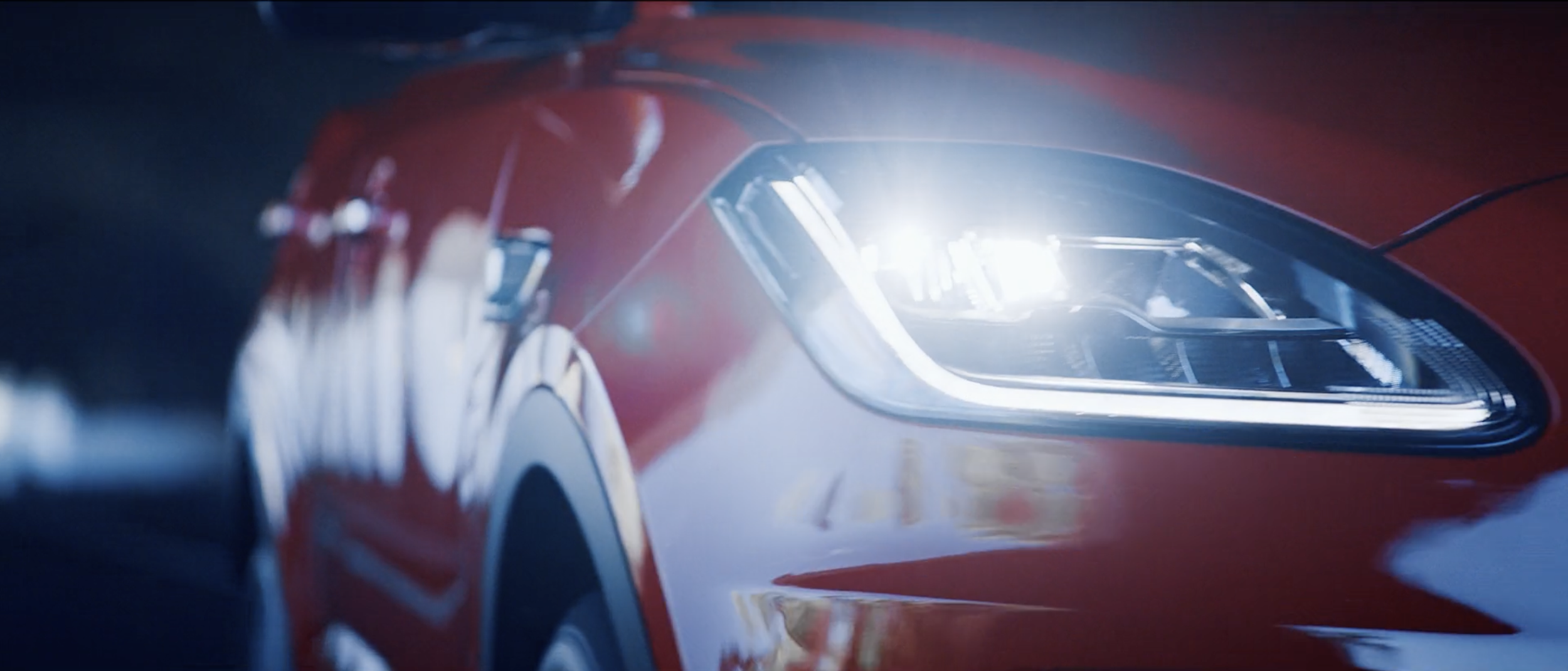 Stylish image of a red Jaguar E-PACE in a commercial filmed on location in Tenerife by cinematographer Callan Green ACS NZCS