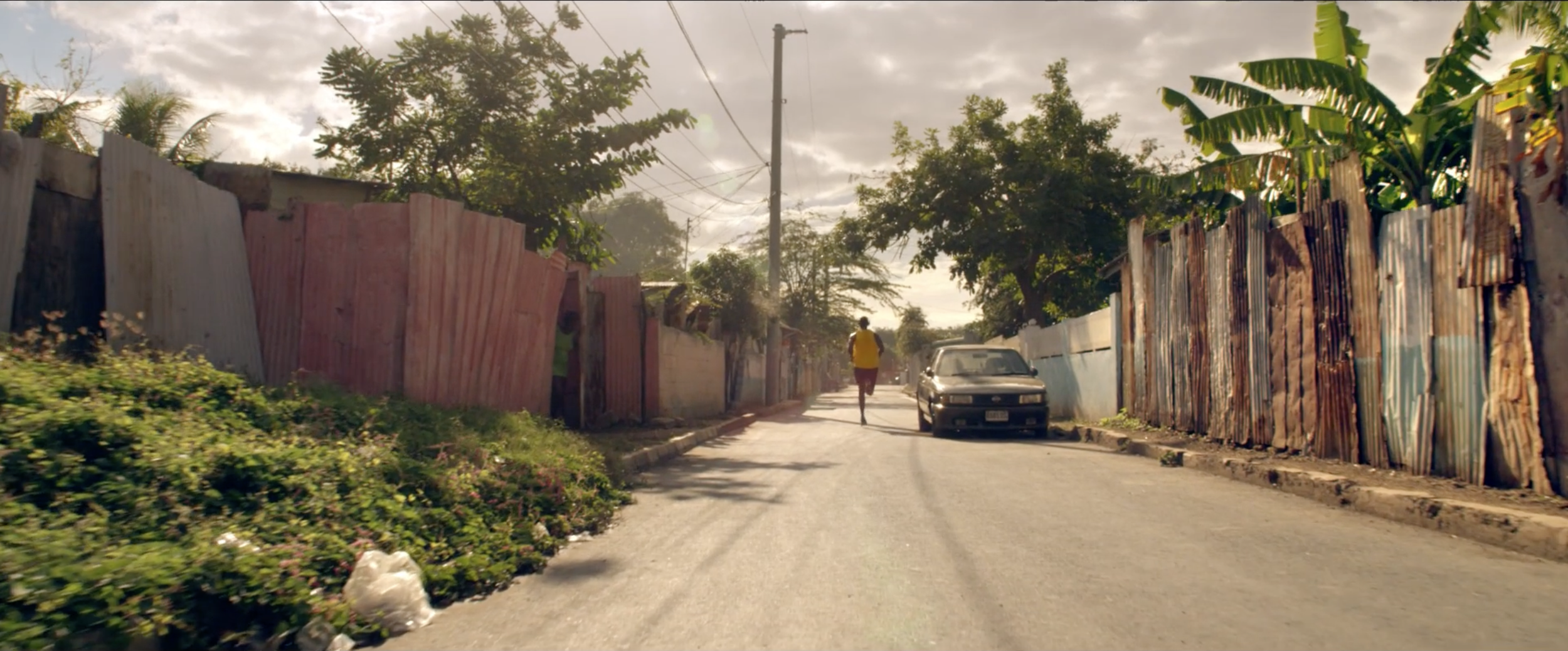 Playful and colourful image from a Gibson Headphones commercial starring Usain Bolt filmed by cinematographer Callan Green ACS NZCS in Jamaica.