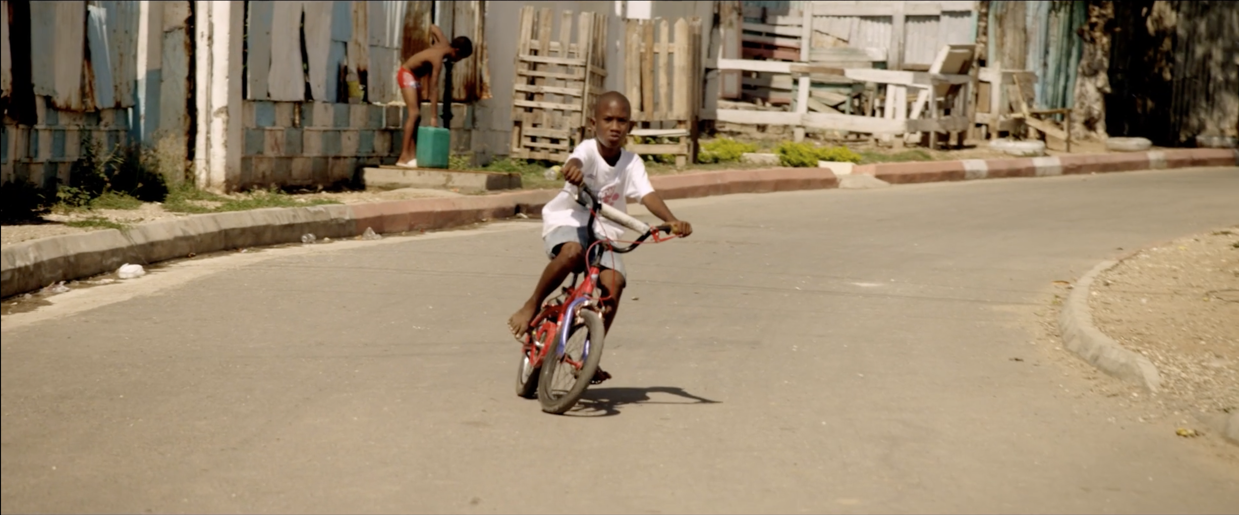 Playful and colourful image from a Gibson Headphones commercial starring Usain Bolt filmed by cinematographer Callan Green ACS NZCS in Jamaica.