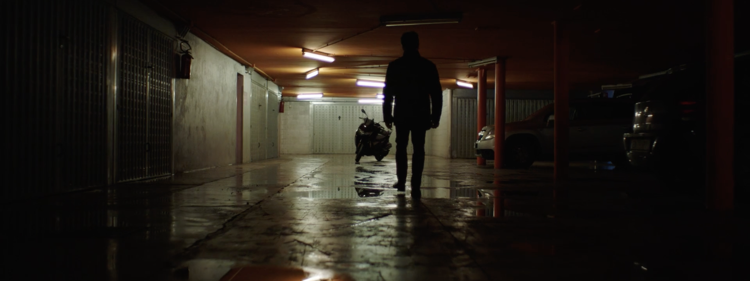 Stylish image of a man preparing to ride his motorbike in a BMW Motorrad commercial, filmed on location in Genoa, Italy, with cinematography by Callan Green ACS NZCS