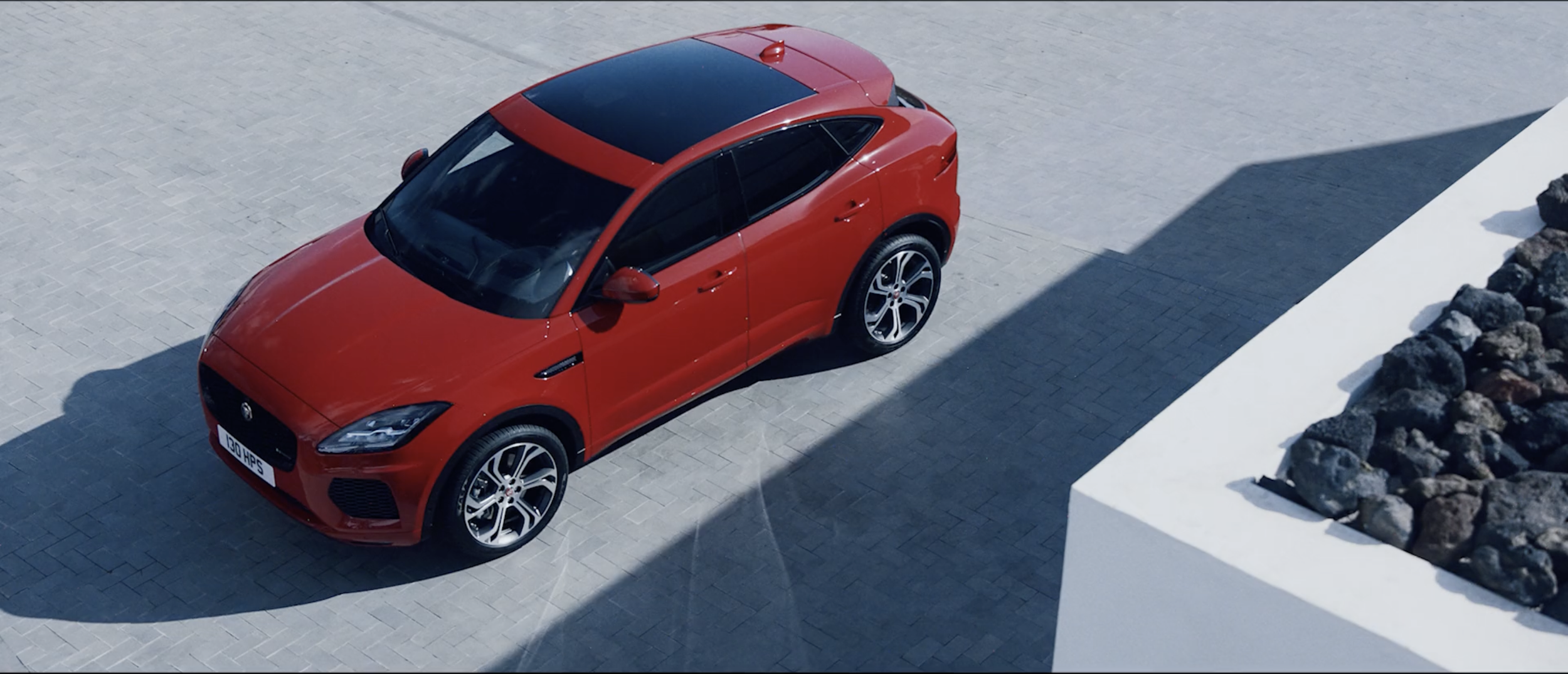 Stylish image of a red Jaguar E-PACE in a commercial filmed on location in Tenerife by cinematographer Callan Green ACS NZCS