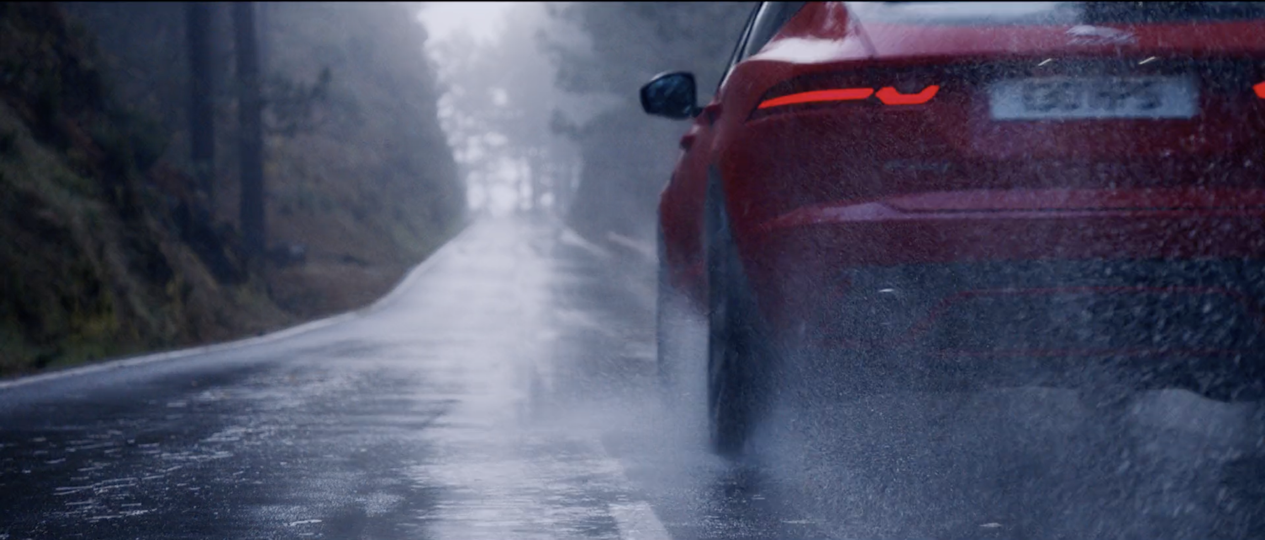 Stylish image of a red Jaguar E-PACE in a commercial filmed on location in Tenerife by cinematographer Callan Green ACS NZCS