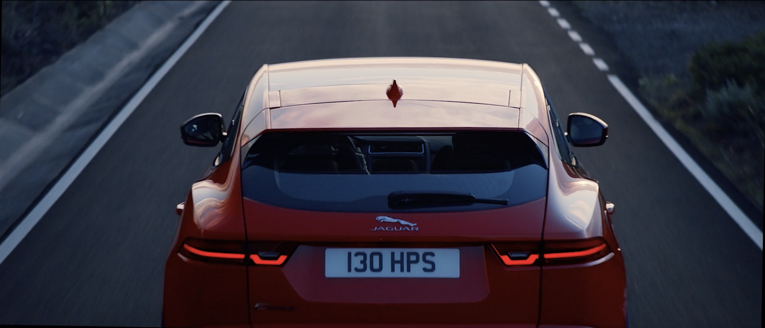 Stylish image of a red Jaguar E-PACE in a commercial filmed on location in Tenerife by cinematographer Callan Green ACS NZCS