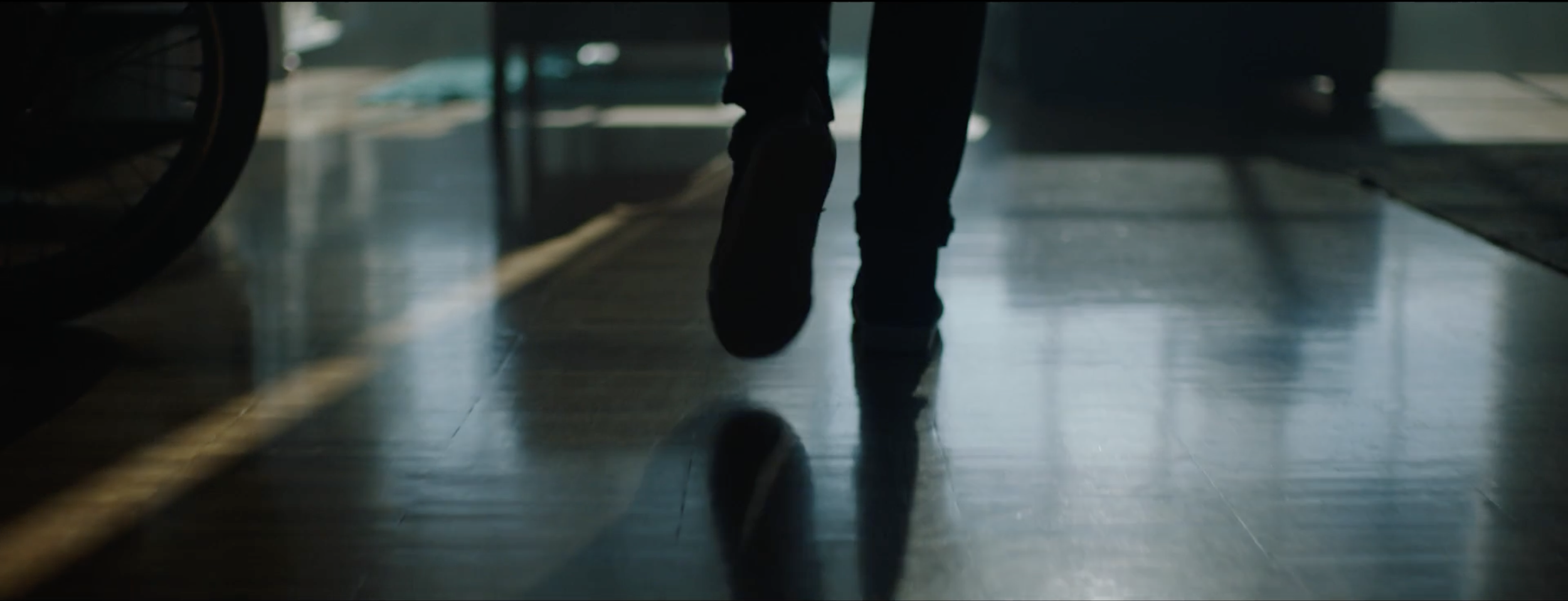 Stylish image of a man preparing to ride his motorbike in a BMW Motorrad commercial, filmed on location in Genoa, Italy, with cinematography by Callan Green ACS NZCS