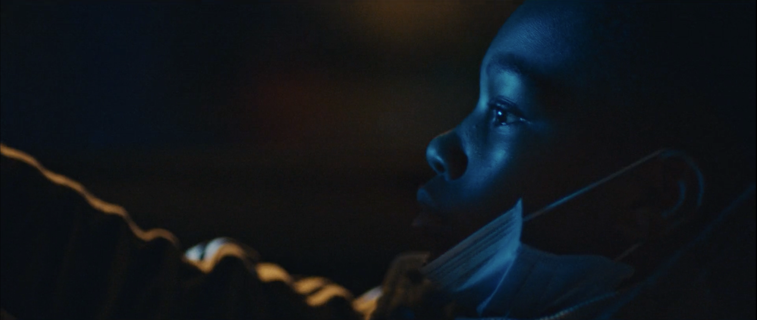 Stylish image OF A YOUNG BOY DRIVING A CAR from Just Banco’s ‘Ashleigh’ music video, filmed on location in Manchester by cinematographer Callan Green ACS NZCS