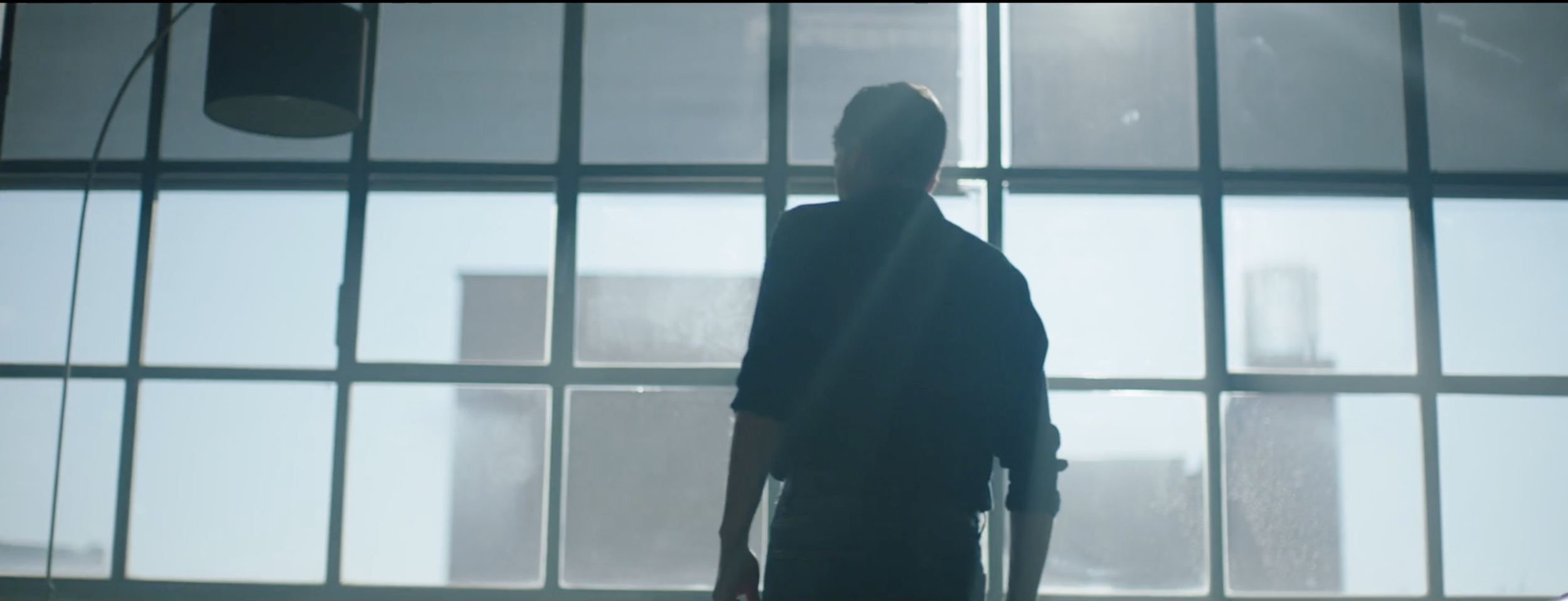Stylish image of a man preparing to ride his motorbike in a BMW Motorrad commercial, filmed on location in Genoa, Italy, with cinematography by Callan Green ACS NZCS