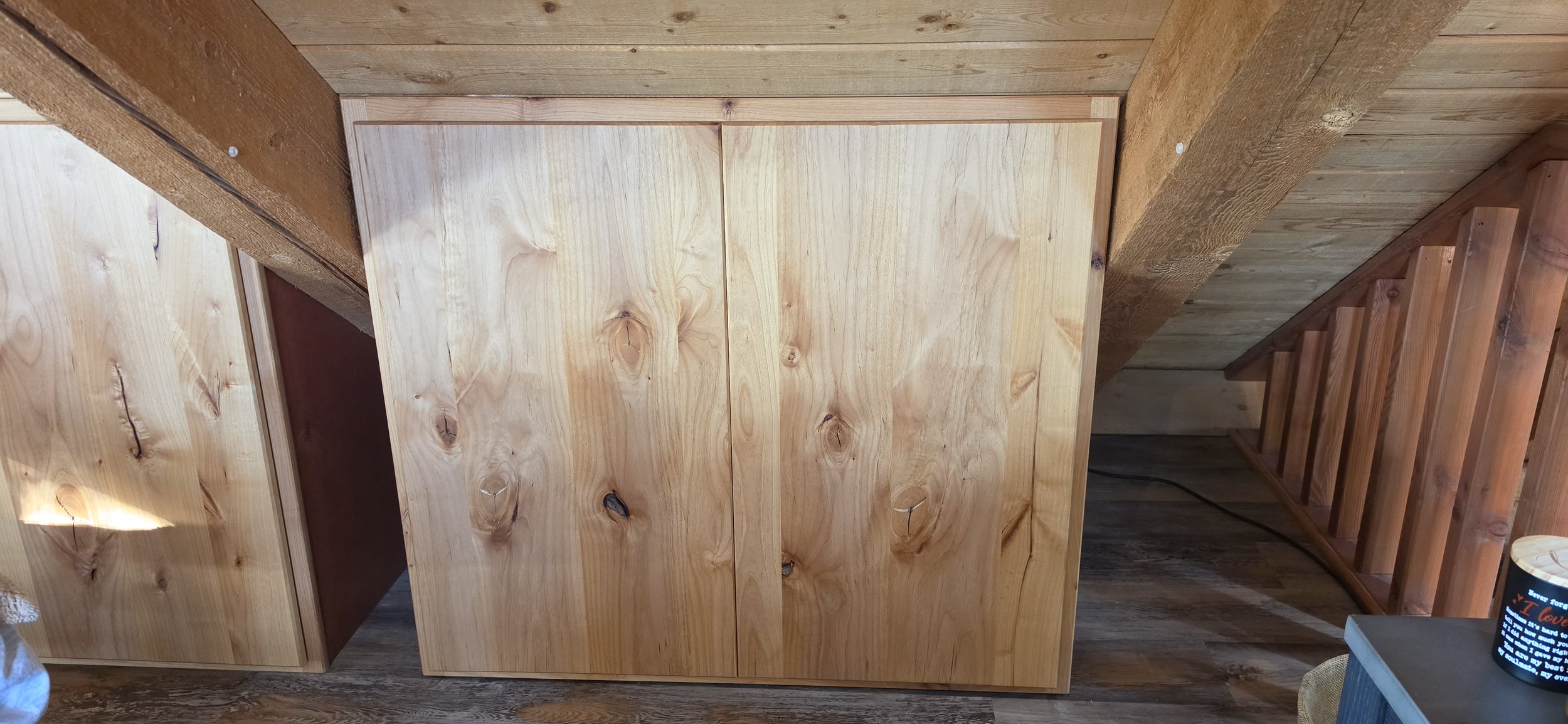 Knotty Alder cabinet #2 with birch stained cases and birch pullout shelf and adjustable shelf. Fit to the roof line. Strawberry, AZ