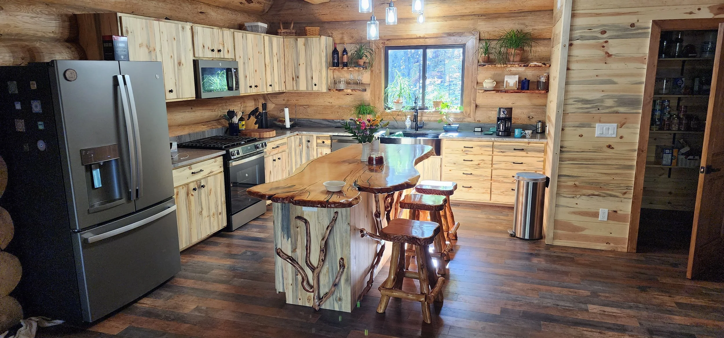 Cabinets only by us. Crafted from, Blue Pine T&G milled for face frames, doors, drawer fronts and cabinet ends w/ natural oil finish. 3/4 & 1/2" Birch plywood for cabinet cases, drawer boxes and shelves.
Island countertop and all Manzanita accents in