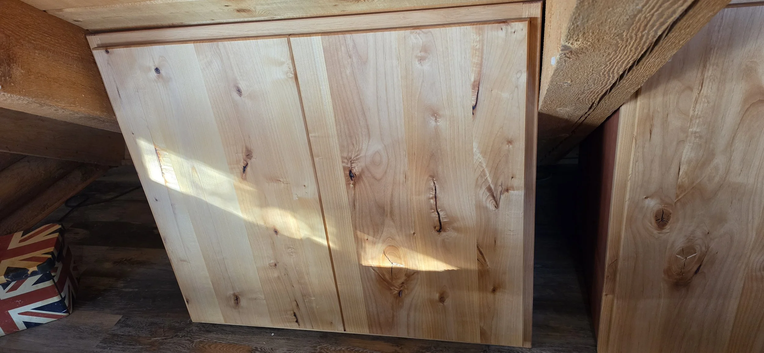 Knotty Alder cabinet #1 with birch stained cases and birch pullout shelf and adjustable shelf. Fit to the roof line. Strawberry, AZ