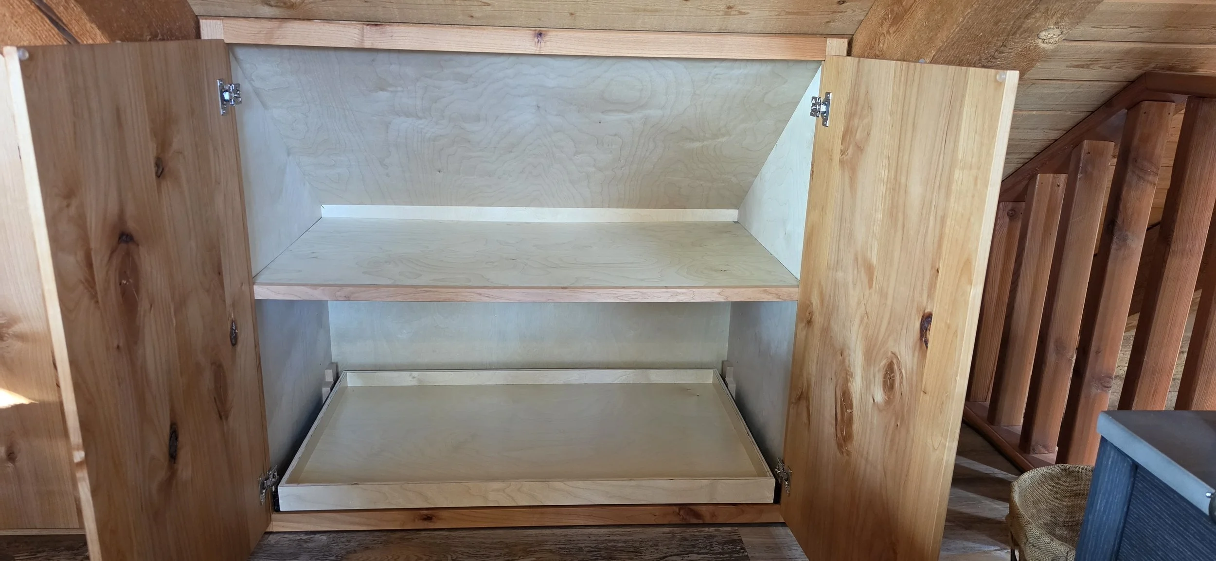 Knotty Alder cabinet inside #1 & 2 with birch stained cases and birch pullout shelf and adjustable shelf. Fit to the roof line. Strawberry, AZ