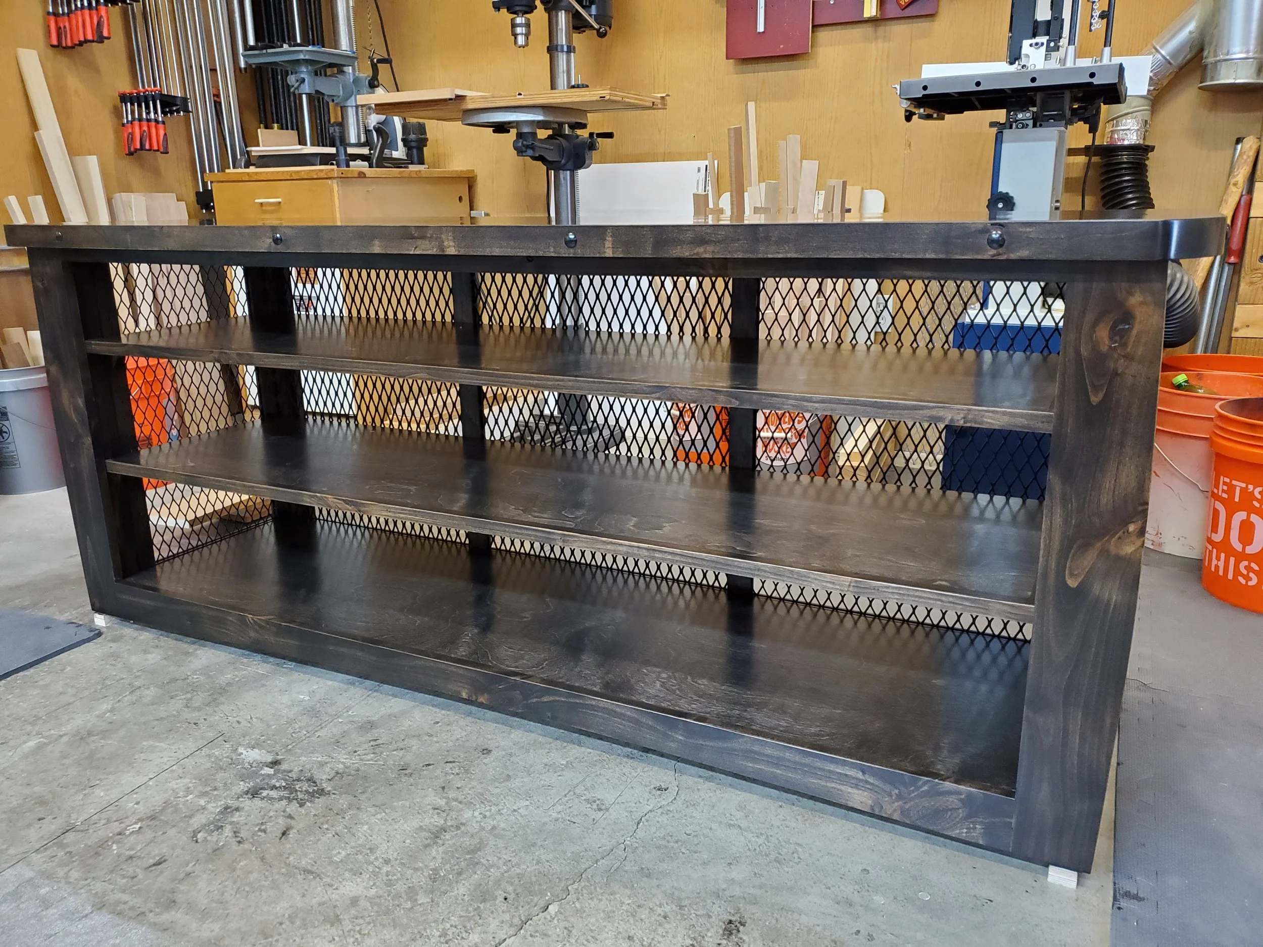 Alder-stained w/ expanded steel panels w. cast iron accents. Peoria, AZ 