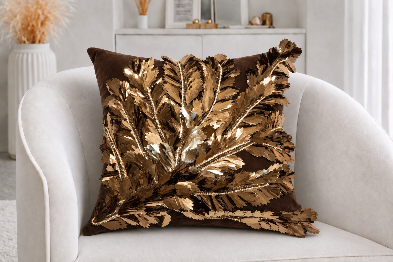 PHYLLIS IN AUTUMN  (side 1) 
Cocoa Desireé Studio 
Sculptural bronze leaves and crystal details sweep across rich chocolate suede, creating movement, dimension, and luminous shine.  
 A personalized message embroidered in gold transforms the reverse 