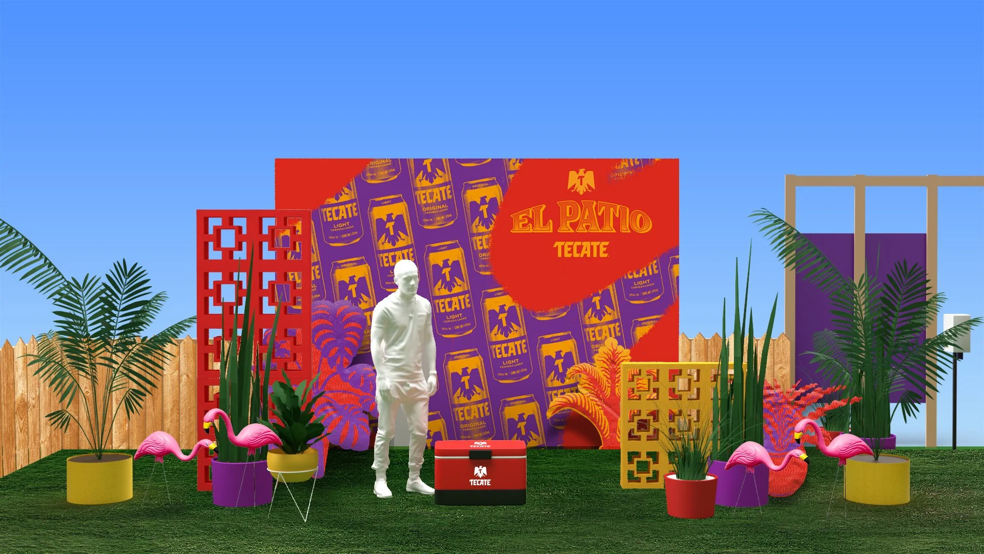 Decoración colorida en un patio con plantas, flamingos de plástico rosa, y un fondo con el logo de Tecate y un cartel que dice 'El Patio Tecate'.
