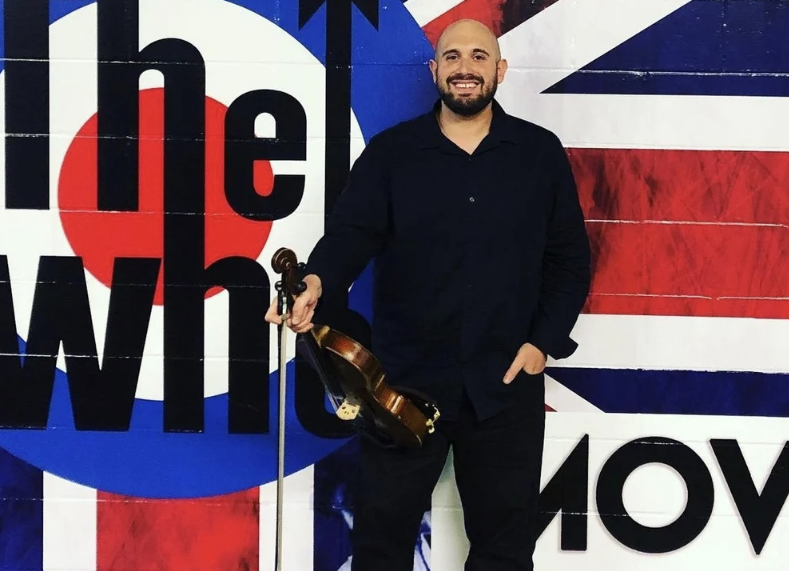 Stephen, violinist with Luxe Entertainment, during The Who tour off stage