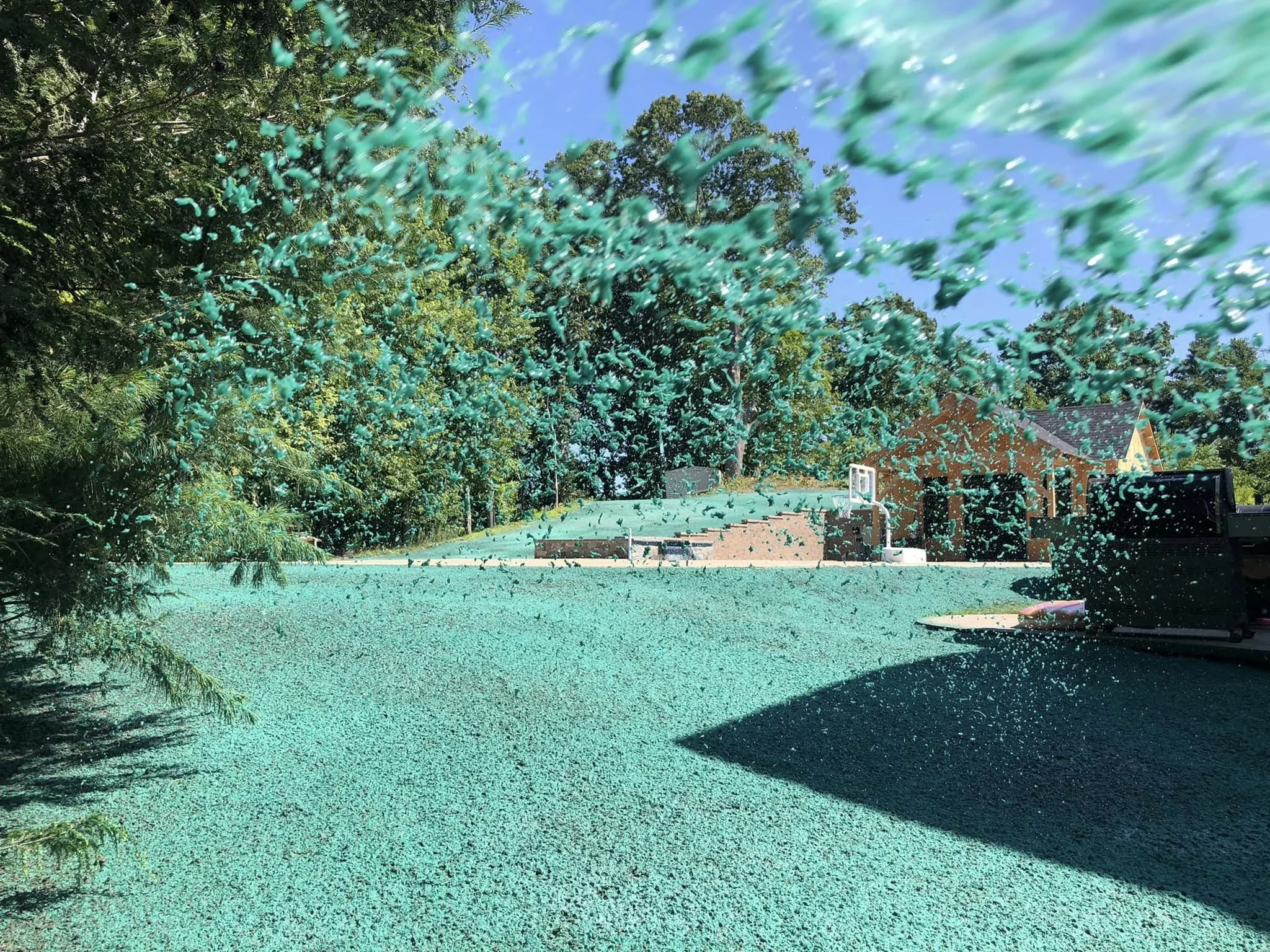 A lawn with hydroseed being applied