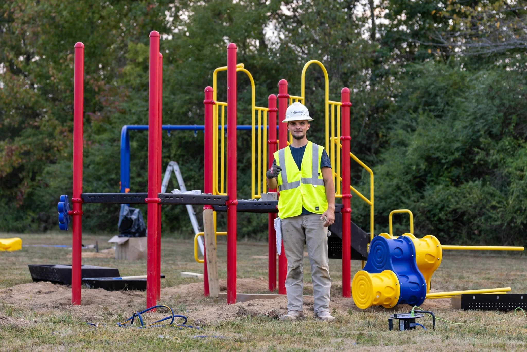 ApexElite crew installing commercial playground equipment in Alabama
