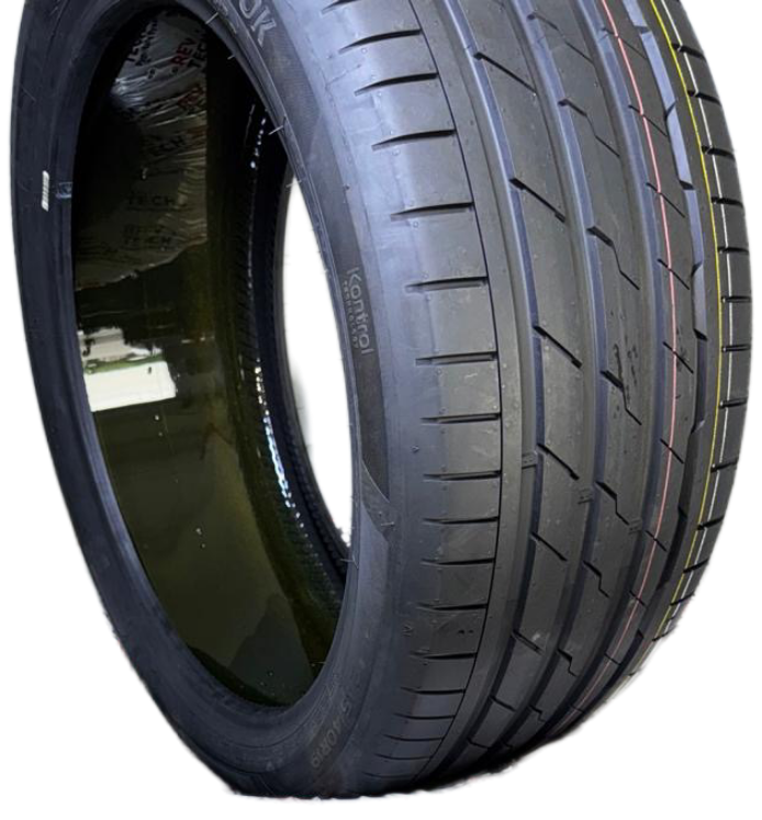 A close-up of a new Goodyear tire showing its tread pattern and sidewall.