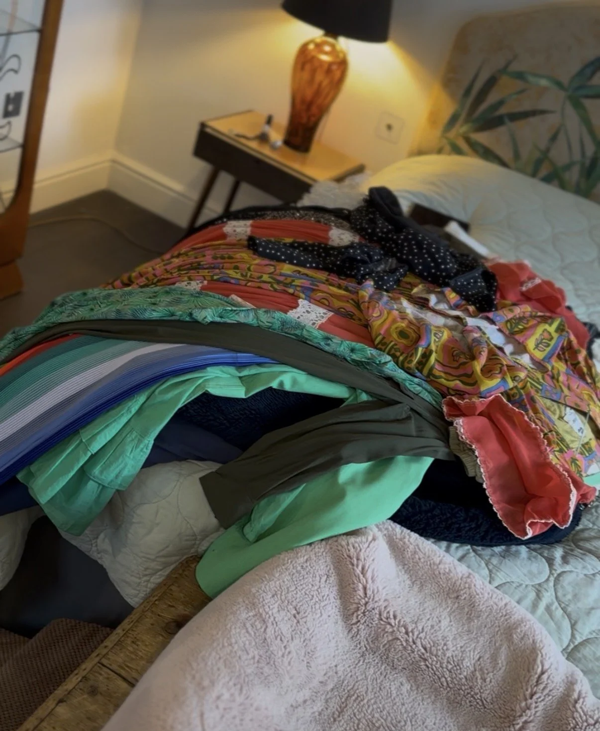 editing clothes on a bed