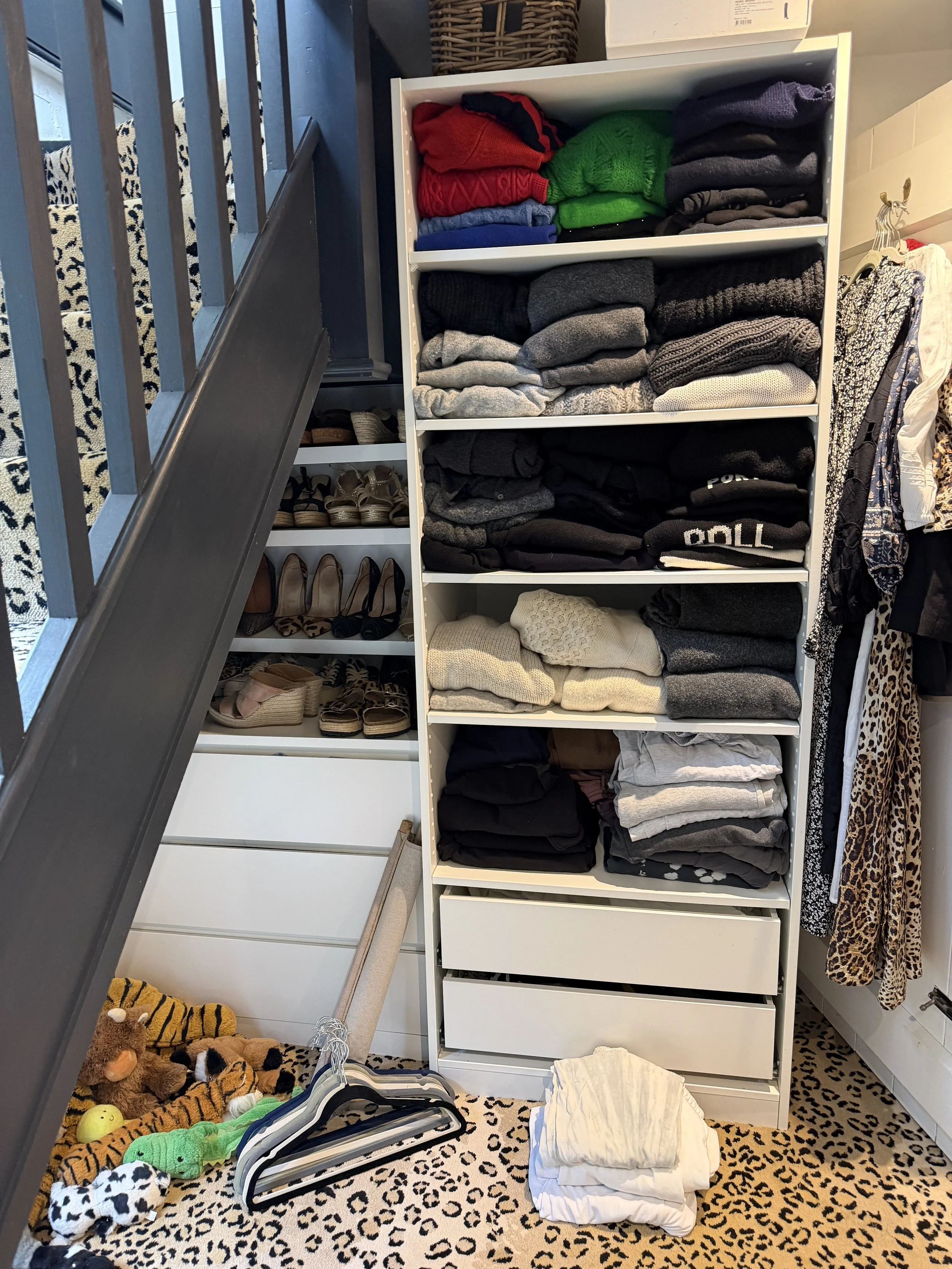 jumpers reset in specific open cupboard