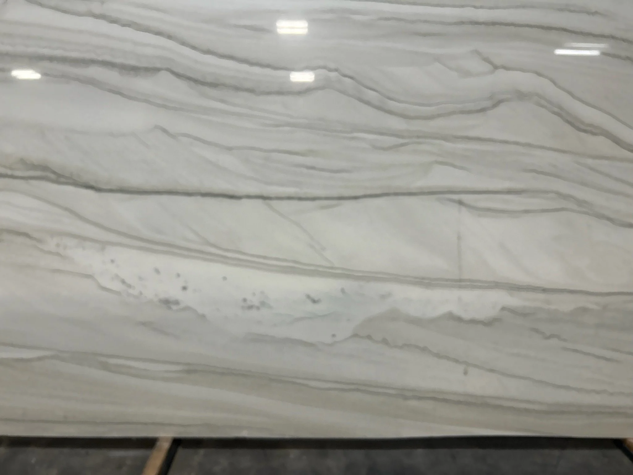 Close-up of a white marble surface with gray veining.