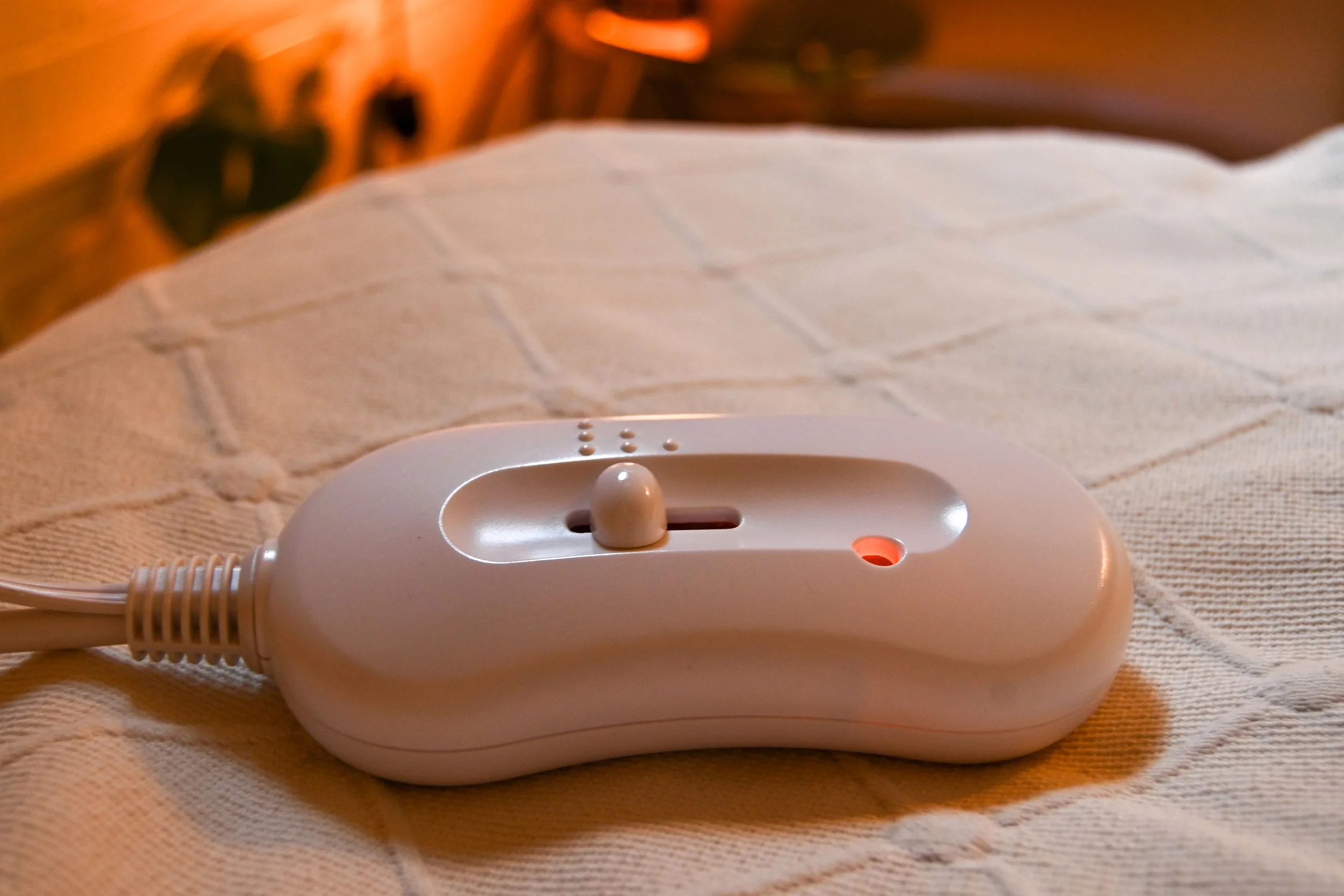 TREATMENT ROOM: Massage table is fitted with a table warmer.