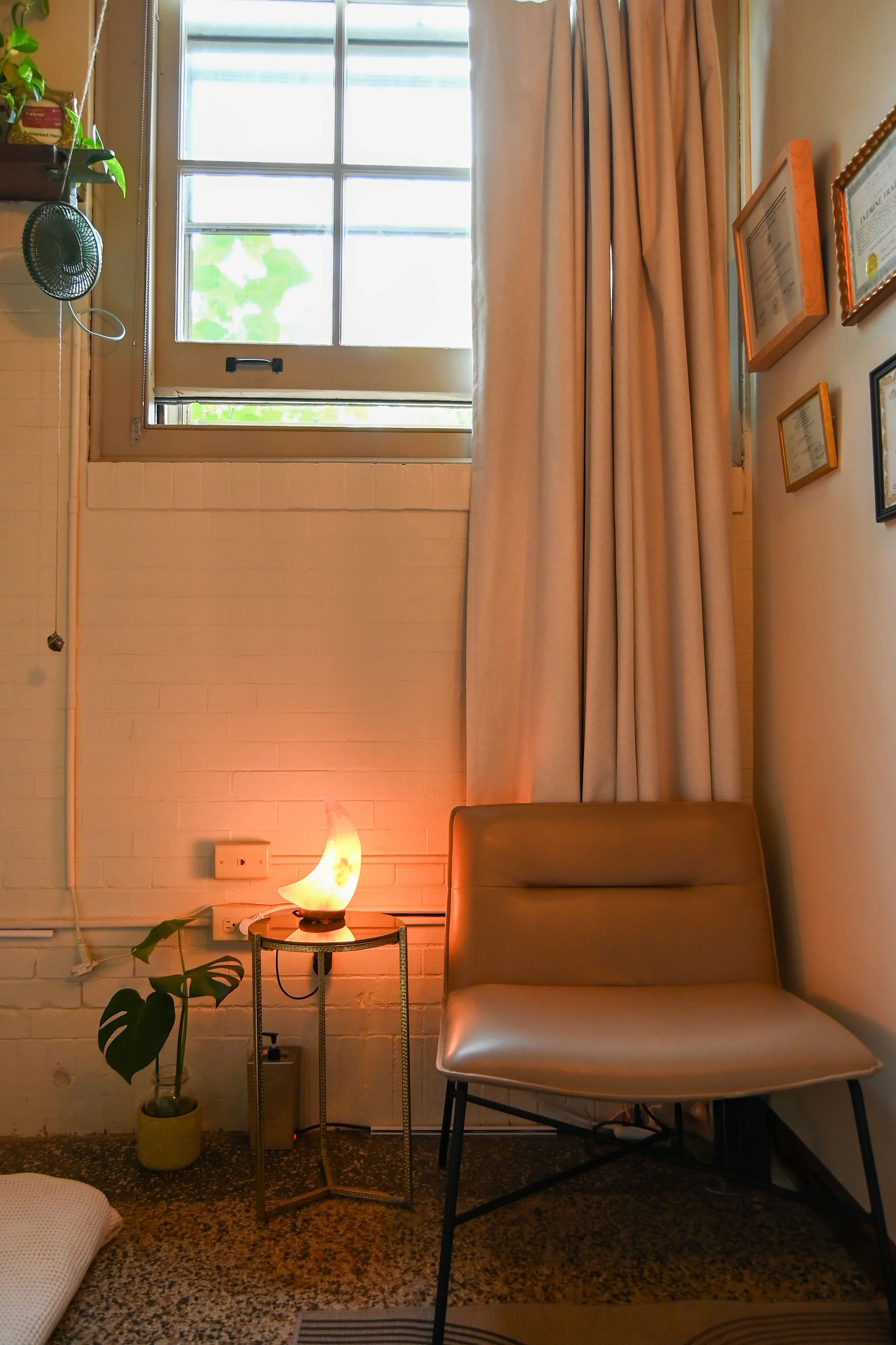 TREATMENT ROOM: Sturdy, wide, armless chair for clients.
