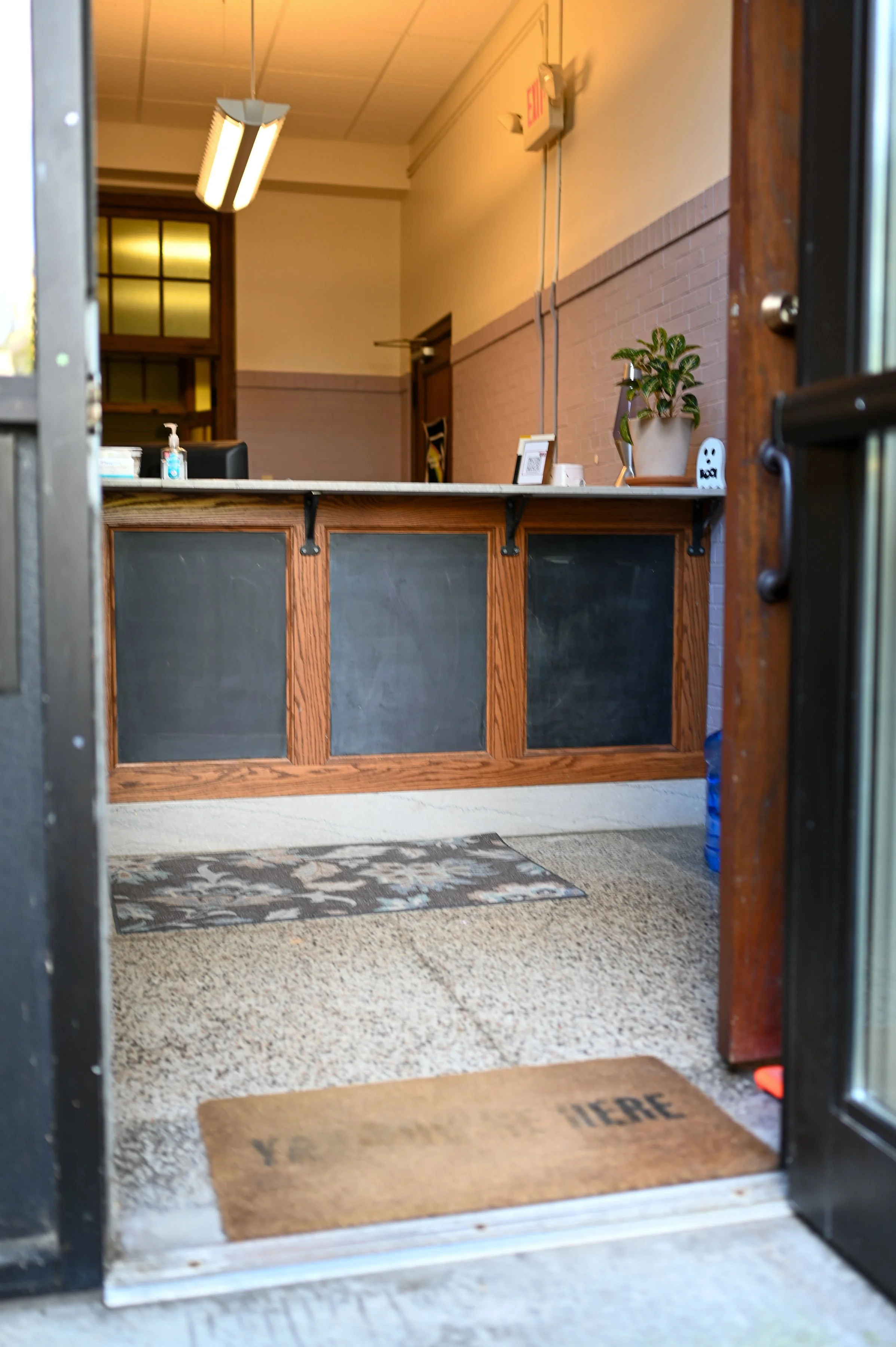 OUR OFFICE SUITE: Our door opens to the front desk. You're here!