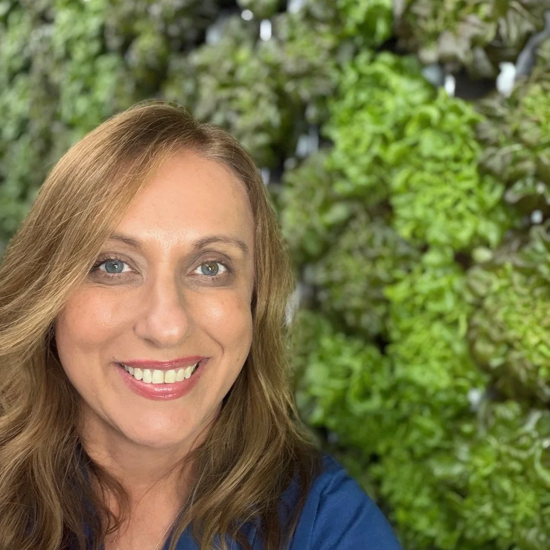 Hi, I'm Christy- the farmer behind every head of lettuce and herbs that comes out of Old South Hydroponics. If you've ever wondered who's tending the greens you bring home every week...it's me standing right here in the Freight Farm surrounded by the