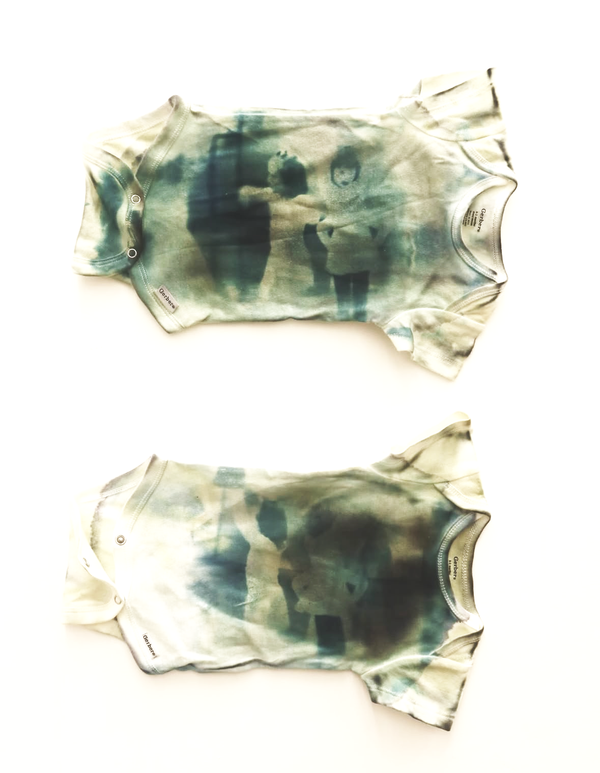 untitled (2025) Dimensions vary, Cotton baby clothes, Cyanotype, Loose pigment 