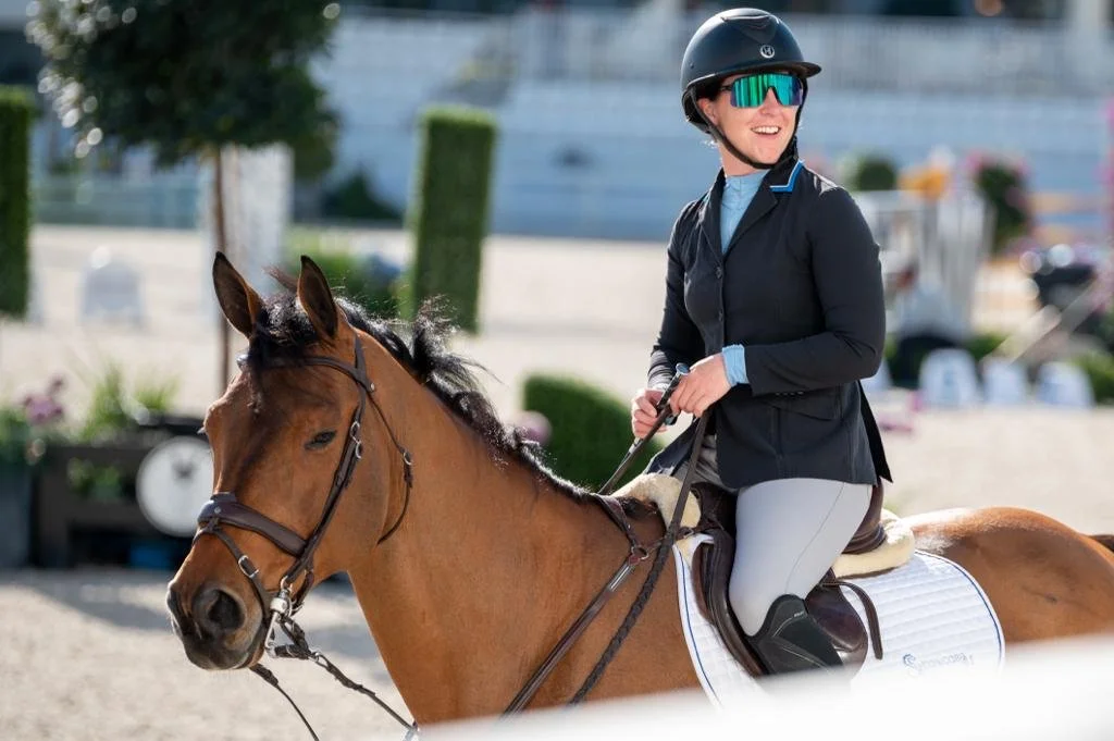 Bryn Sadler riding Catch the Dollar walking out of the ring and smiling at WEC Ocala, Florida