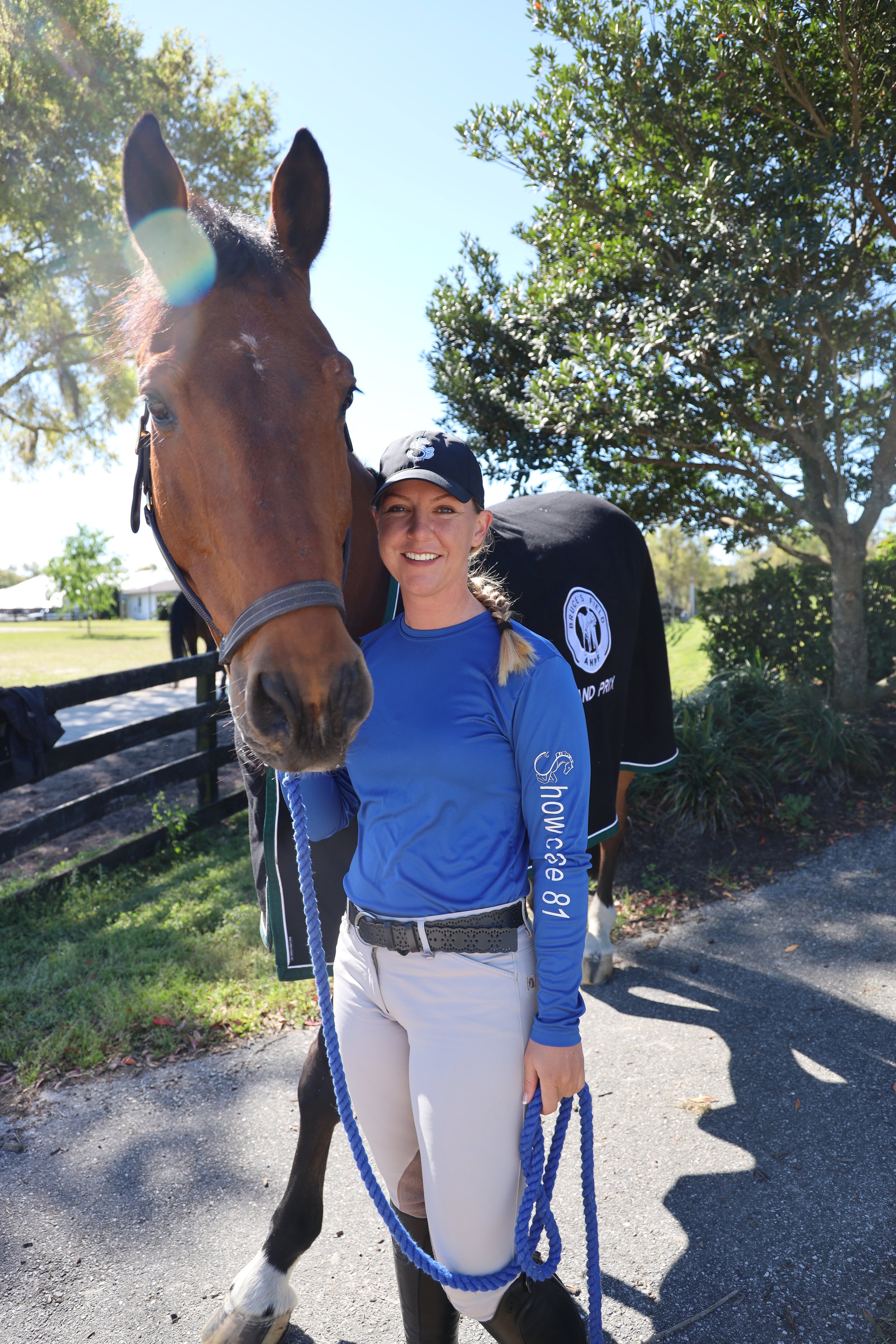 Bryn Sadler smiling with a horse at GS Equestrian in Ocala, Florida