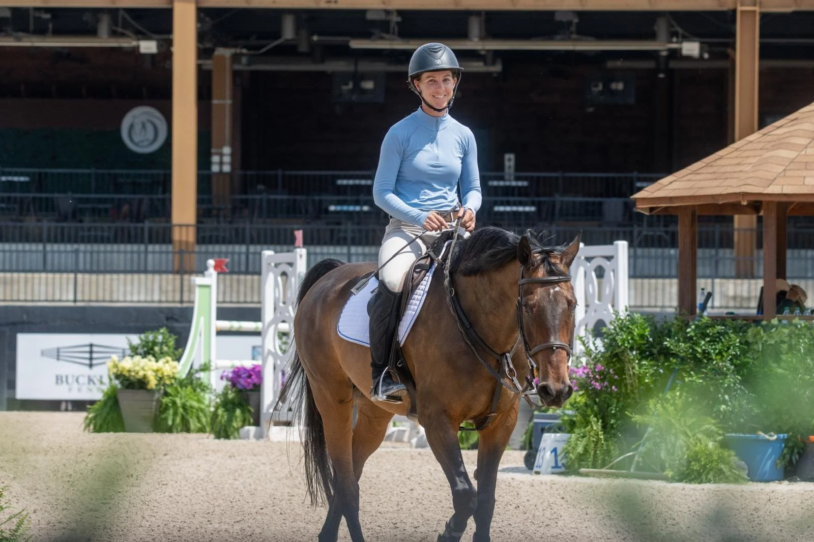 Bryn Sadler walking out of the ring on Cezarro at Tryon International Equestrian Center in North Carolina