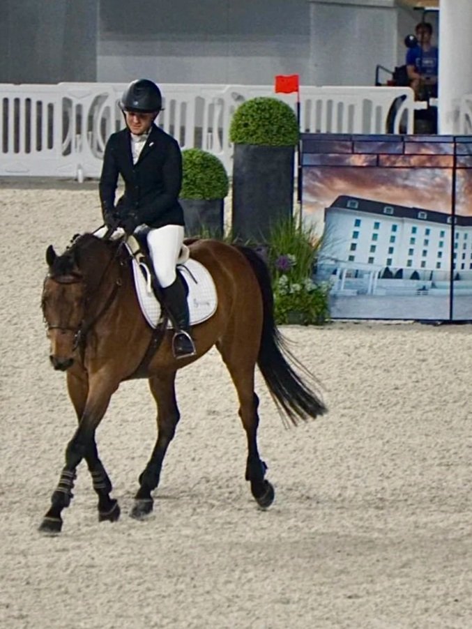 Cinven CR (Cilantro) under saddle, approaching the camera.