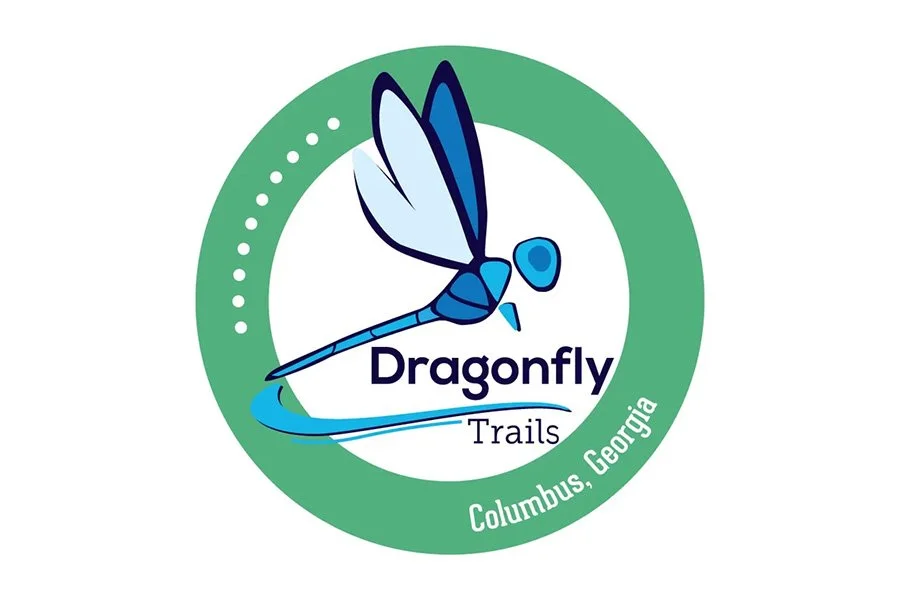 Logo for Dragonfly Trails in Columbus, Georgia featuring a blue dragonfly.