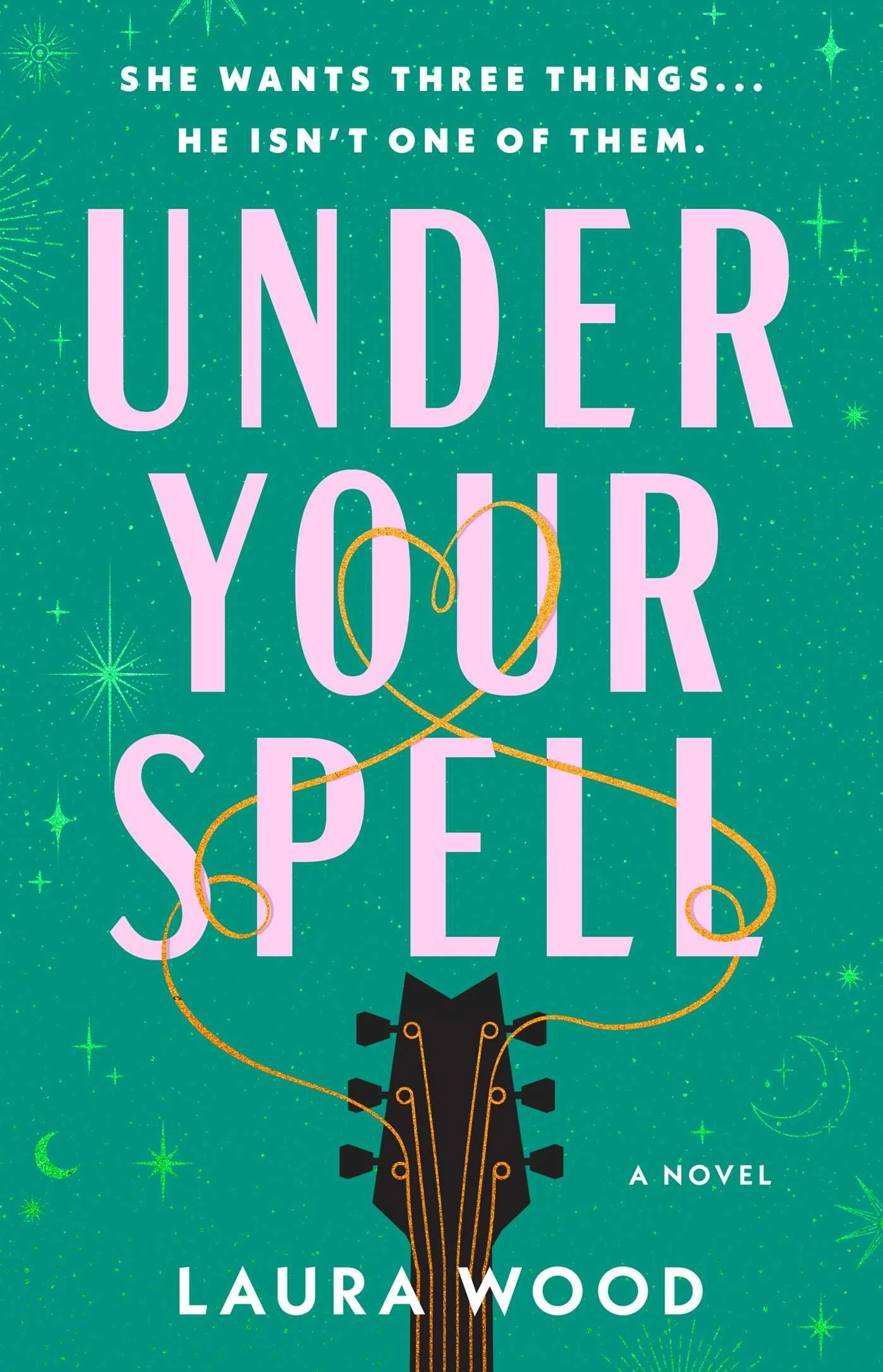 Large pink letters spell out the title "Under Your Spell" over a teal background with bright green starbursts. Below the title, the neck of a guitar with gold strings that extend above to entwine with the title and form a heart.
